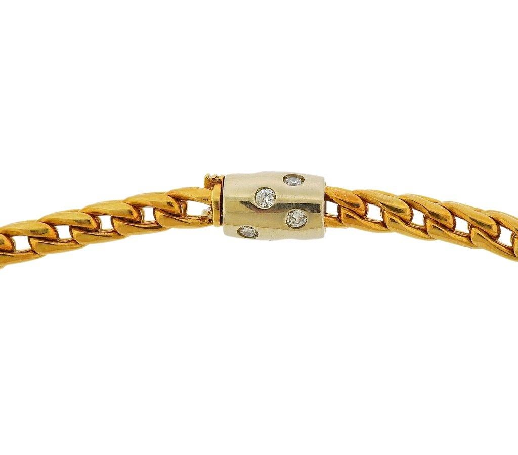 18k yellow gold chain necklace by Pomellato, clasp features approx. 0.36ctw in G/VS diamonds. Necklace is 15.75