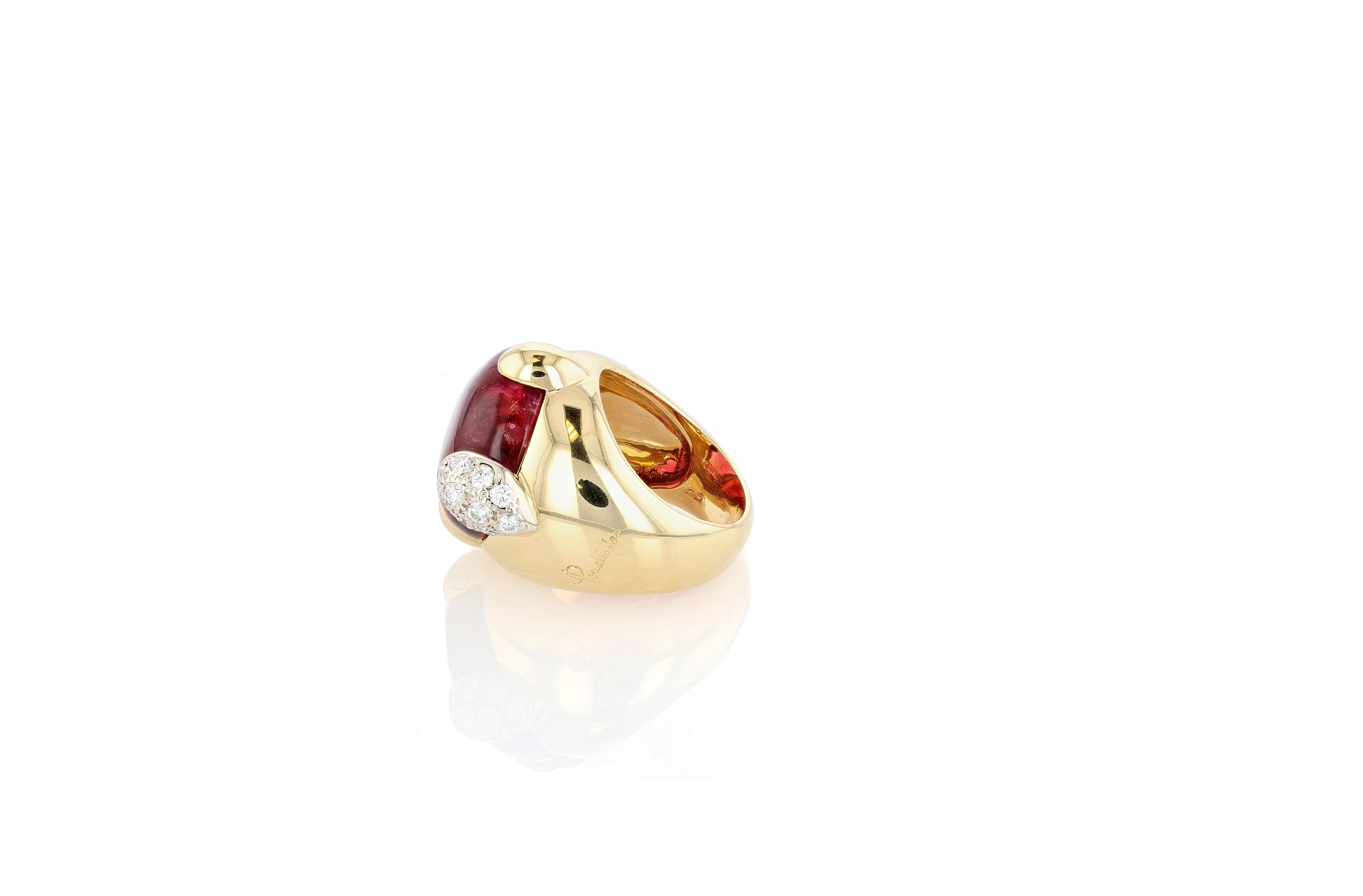 An 18 karat yellow gold Pomellato “Griffe” ring, centering a large, polished and buffed pink tourmaline, the tourmaline featuring four oversized rounded prongs, one of which being pave set with diamonds. The ring is a size 9.

-Signed