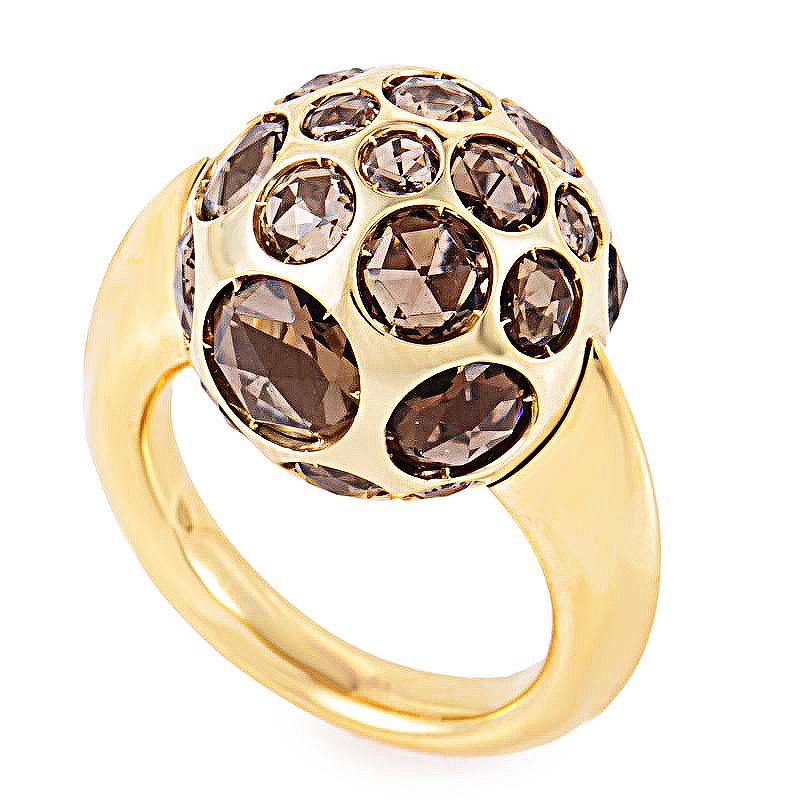 This Pomellato Harem ring is playful yet mature- perfect for a sophisticated lady. It is made of 18K rose gold and features numerous smokey quartz gemstones embedded into the ring.
