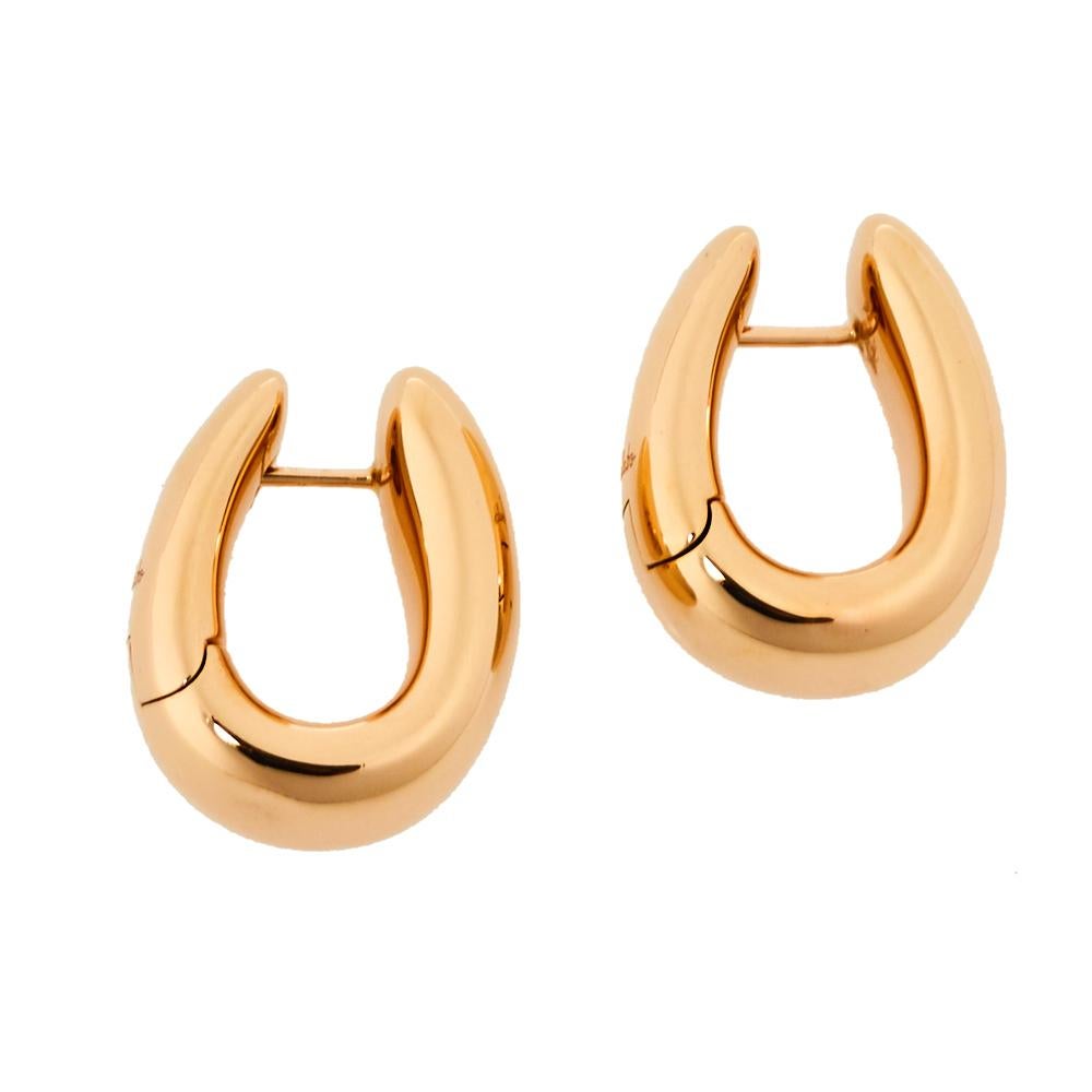Pomellato's Iconia collection pays tribute to the label's goldsmith heritage that understates an exuberant expression for an elegant touch. Sculpted from 18K rose gold, it features a high-shine polished finish. The earrings are the perfect way to