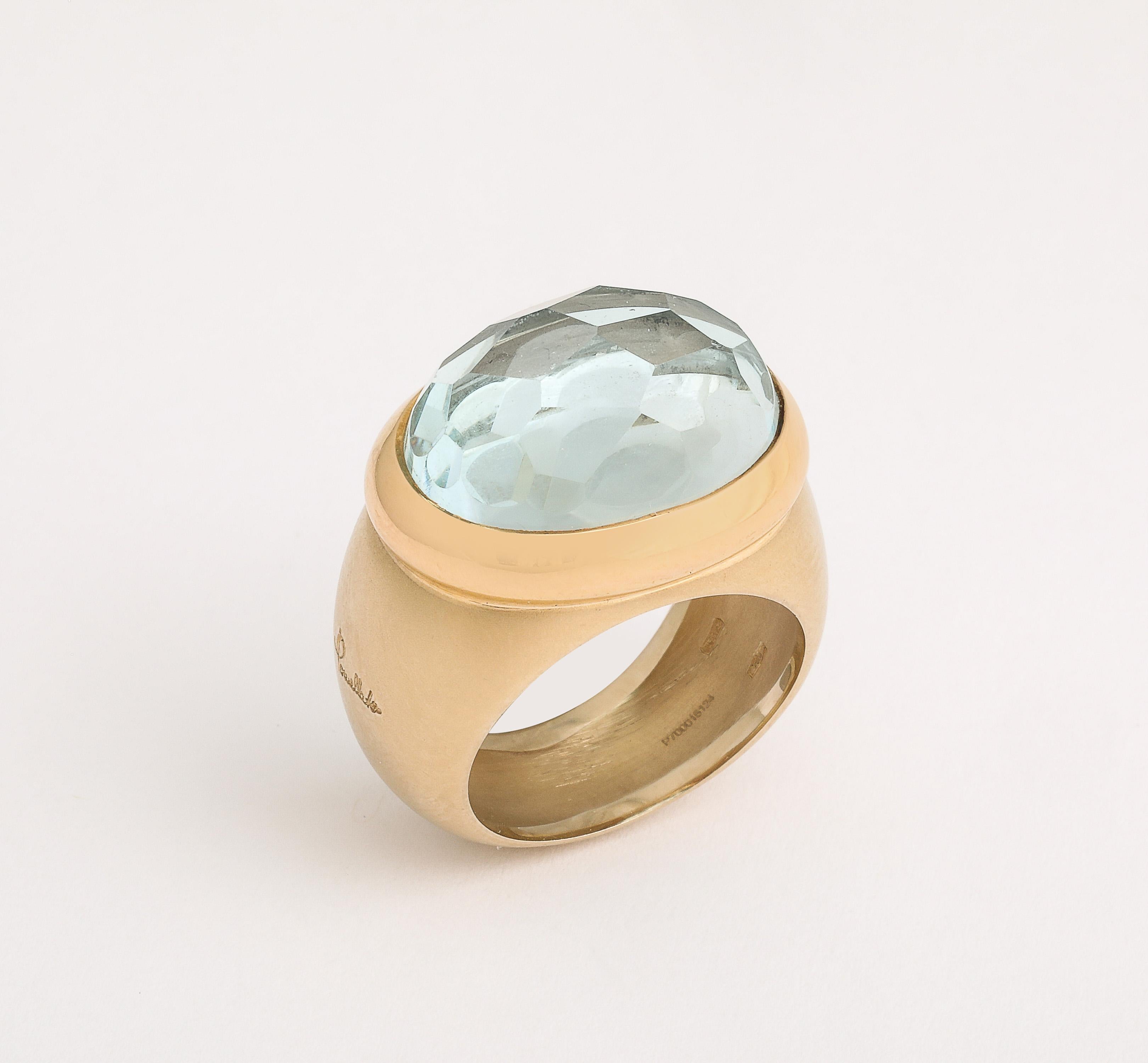 Italian Faceted Aquamarine Ring Signed Pomellato on outside shank in script  Marked with Italian 750 and Italian control marks.  Fancy honeycomb cut Aquamarine Stone of approximately 12 carats.   Vintage 1980's and measurements are 27mm top to
