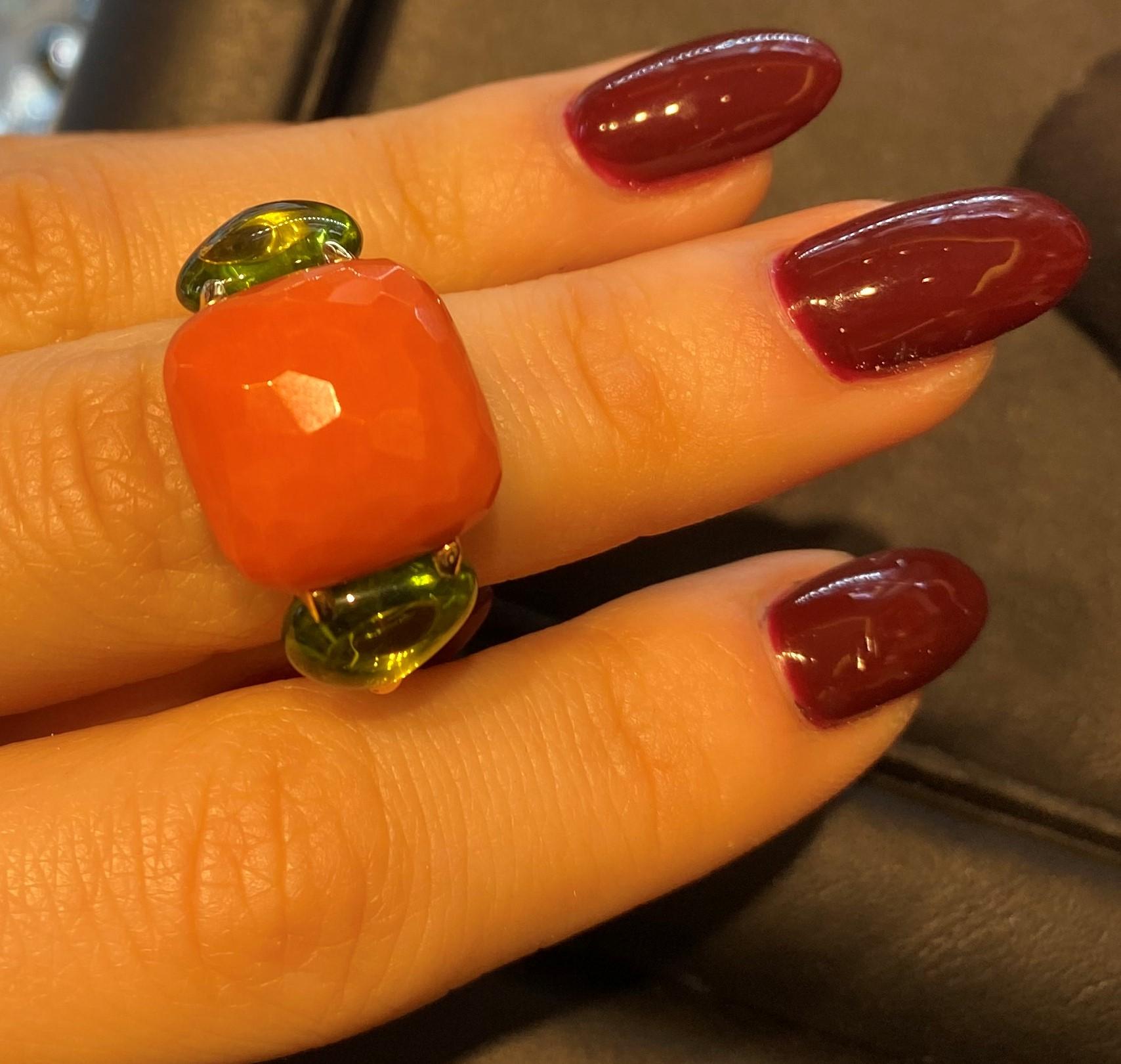 Pomellato Capri Collection Ring in 18 Karat Rose Gold with a central faceted Coral stone sided by two cabochon Peridots 
Size Europe 57
Can be resized 
Comes with Box and Papers 
Original Price: €11,500

READY TO SHIP
*Shipment of this piece is not