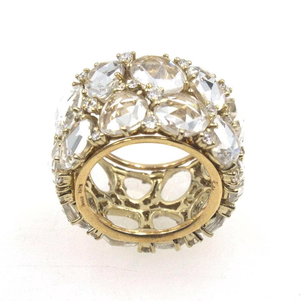 This fabulous designer ring by Pomellato is crafted with white topaz and diamonds. There are 45 round brilliant cut diamonds that equal approximately 1.00 carat total weight. The wide modern band measures 15mm in width and is size 6.5. Signed