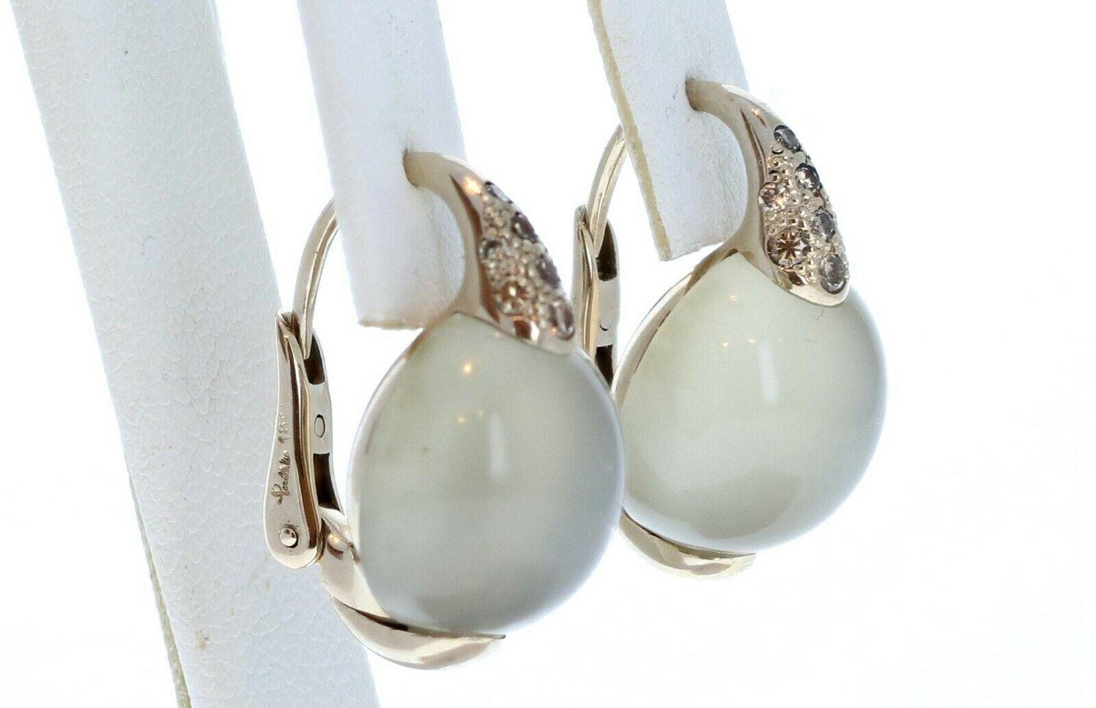 Pomellato Luna 18k Gold Diamond Moonstone Earrings 15.8g

For sale is a stunning pair of 18k gold Pomellato moonstone and diamond earrings. 
Perfect worn day or night.
Get it now! 

Metal: 18k gold

Brand: Pomellato

Earrings Measurement:  22mm X