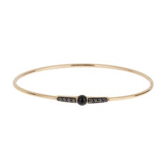 Bracciale M'ama Non M'ama in oro rosa 18k con diamanti e onice di Pomellato