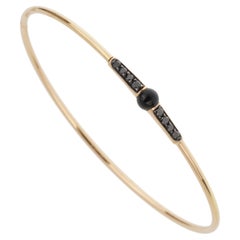 Bracciale M'ama Non M'ama in oro rosa 18k con diamanti e onice di Pomellato