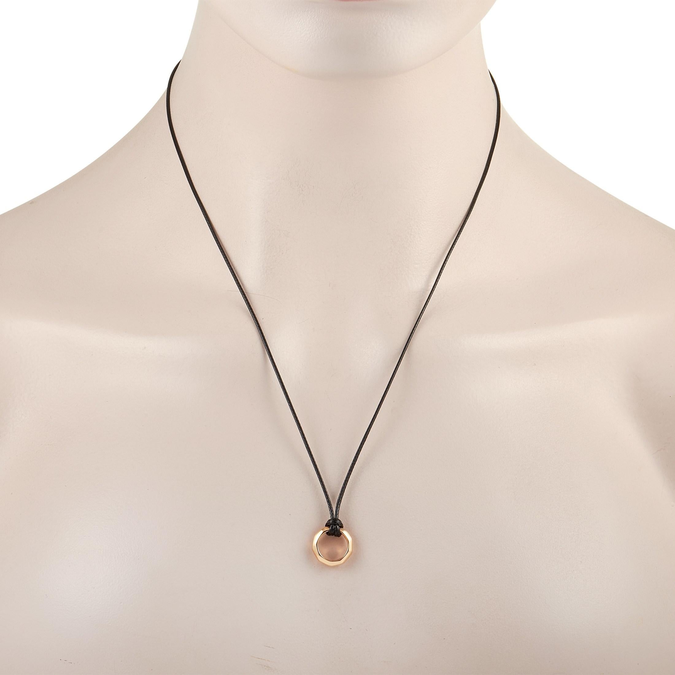 This simple Pomellato Milano 18K Rose Gold Circle Pendant Necklace is full of modern flair. The necklace is made with a black cord measuring 24 inches and features a hollow circle pendant made from 18K rose gold and shaped into a soft octogon. The