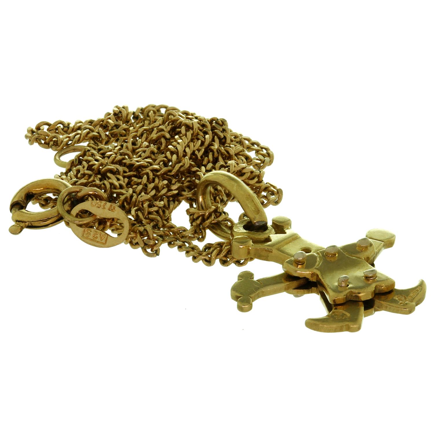 This fabulous necklace features a Pomellato figure pendant with movable arms and legs crafted in 18k yellow gold. Made in Italy circa 2000s. Measurements: 0.66