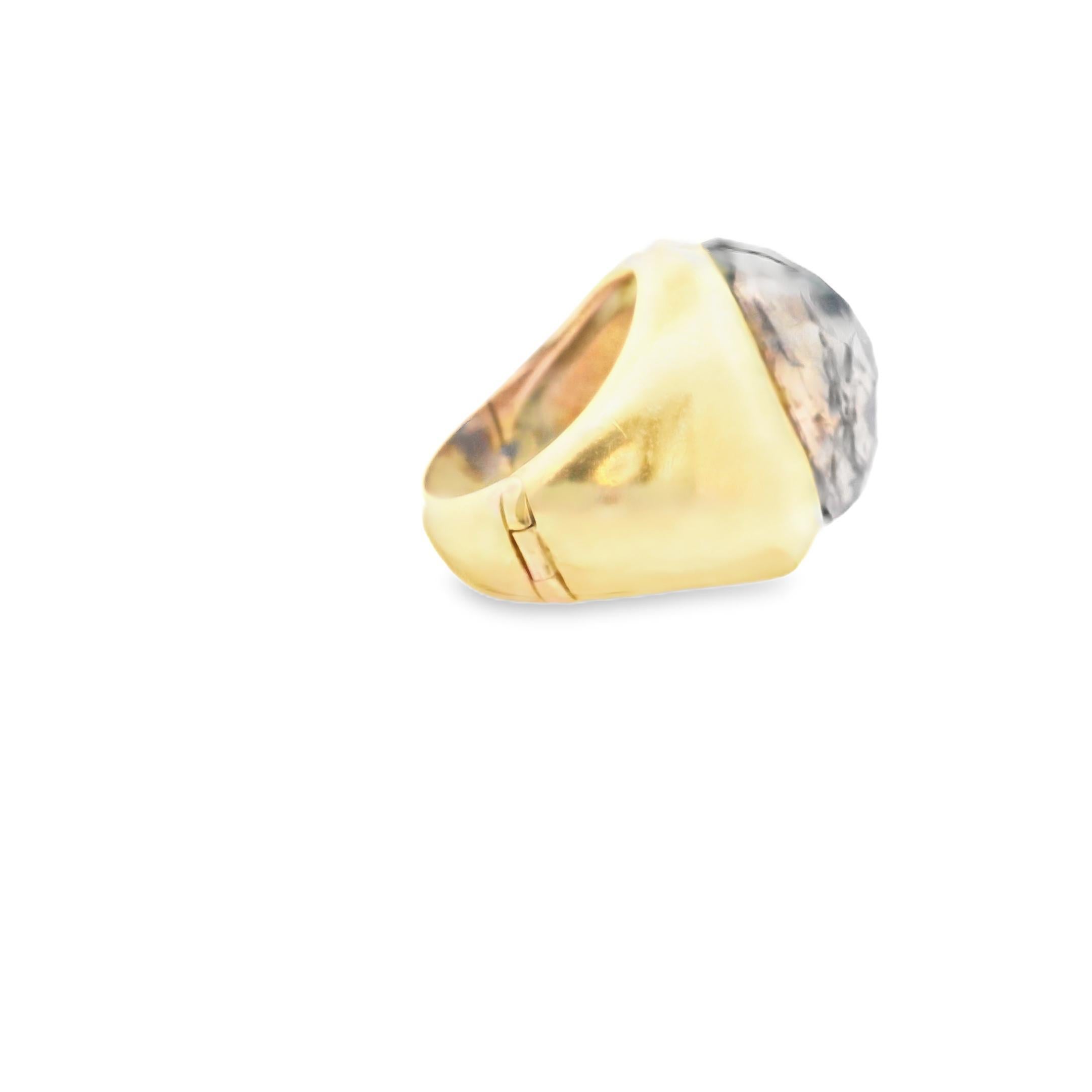 A bold statement of sophistication. This Pomellato ring is for those who wear their style with quiet confidence.

Crafted in 18k gold, the ring features a striking faceted blue stone that commands attention. The smooth, polished band complements the