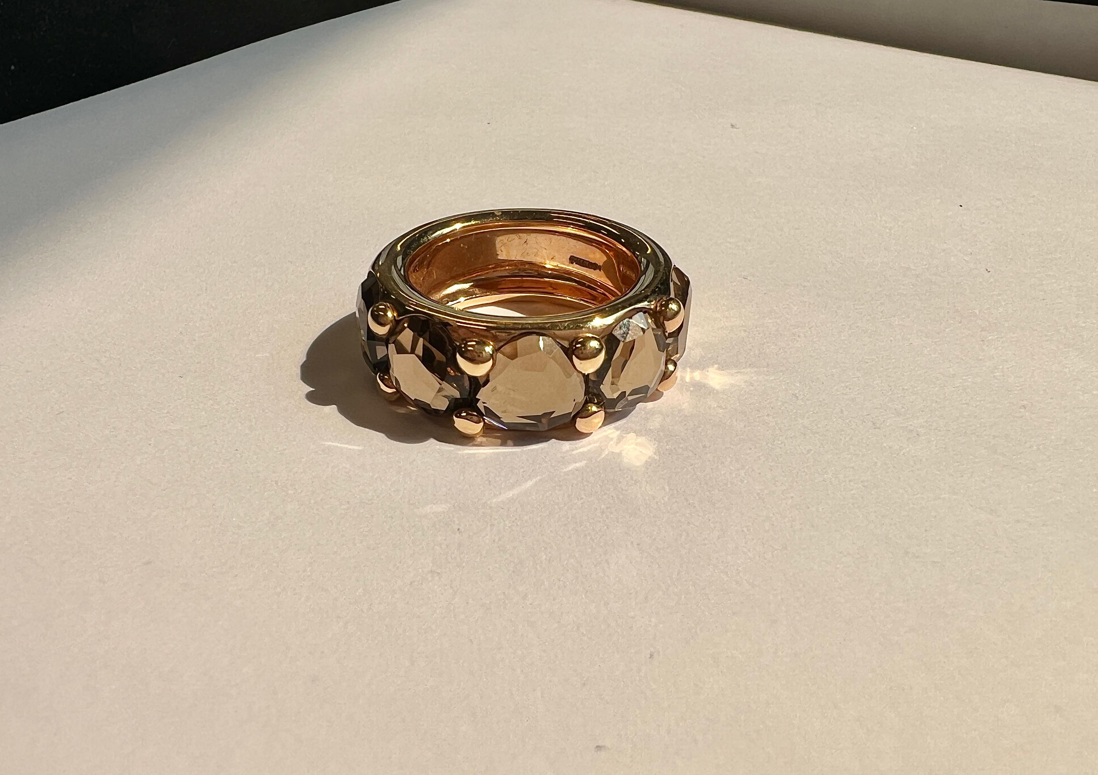 18k gold Narciso ring by Pomellato, with faceted smokey topaz. Ring size - 6.75, ring is 8.5mm wide. Marked: Pomellato, 750, Italian mark and serial number. Weight - 15.8 grams.