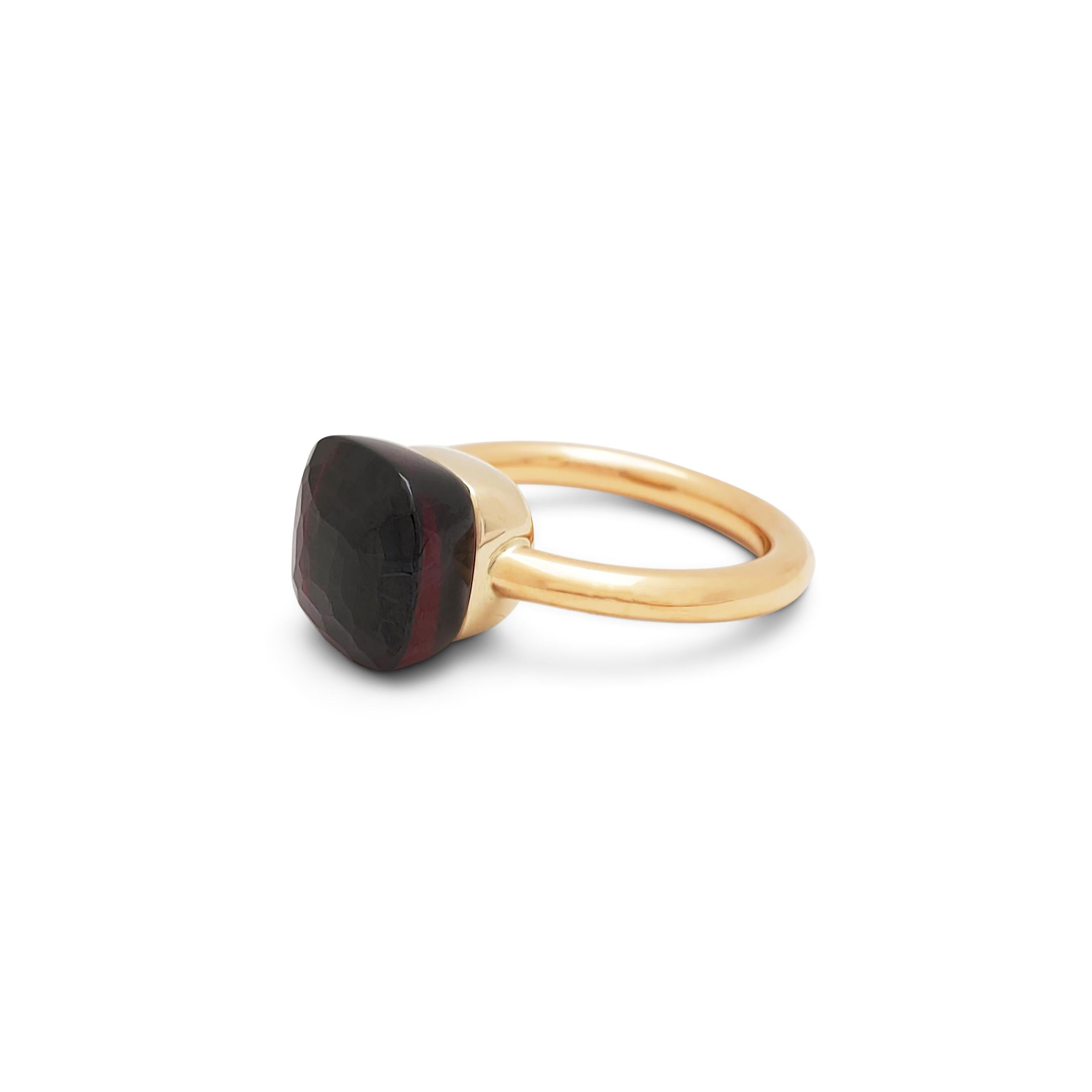 Authentic Pomellato Nudo Classic ring crafted in 18 karat rose and white gold and featuring a faceted garnet stone measuring 10.4mm x 10.4mm. Signed Pomellato. Ring size 6 1/4. Ring is presented with the original box and authenticity card.  CIRCA
