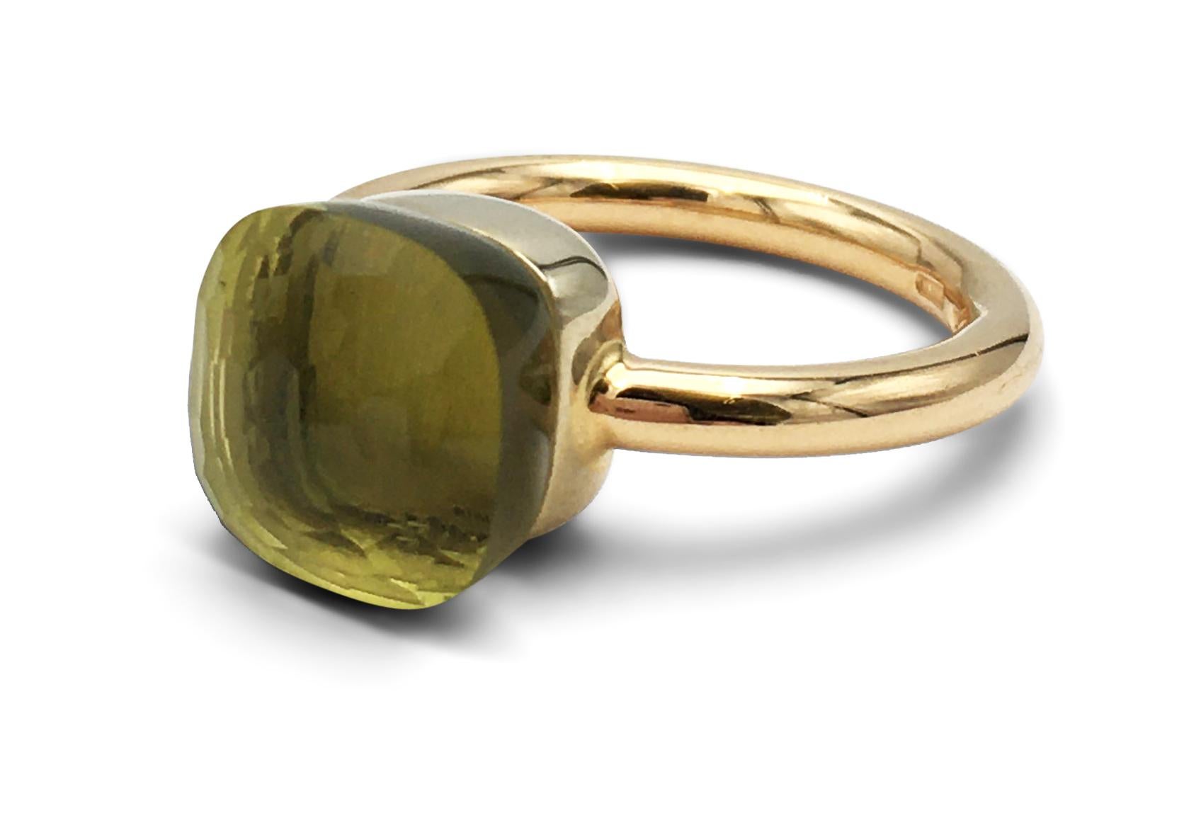 Authentic Pomellato Nudo ring crafted in 18 karat rose gold and featuring a faceted greenish-yellow peridot stone measuring 9mm x 9mm.  Signed Pomellato.  Ring size 7.  Not presented with original box or papers. CIRCA 2010s