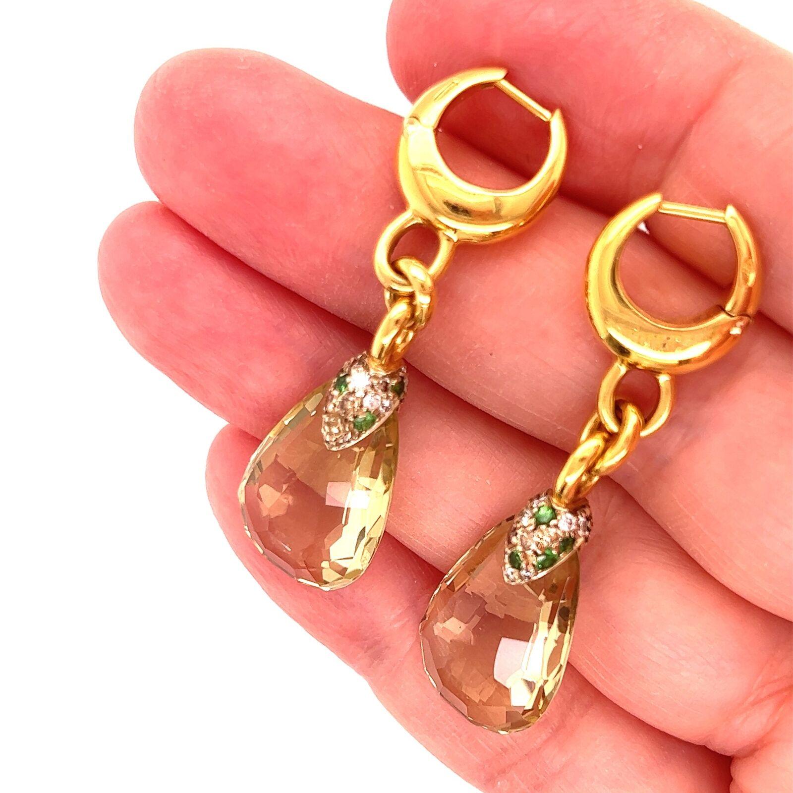 Gorgeous and authentic by Pomellato from the Pin Up Collection. These earrings are crafted from 18k yellow gold with a baby hoop top with posts snap closure, dangling from 3 oval link chain is a large lemon citrine drop with faceted cut, the bail