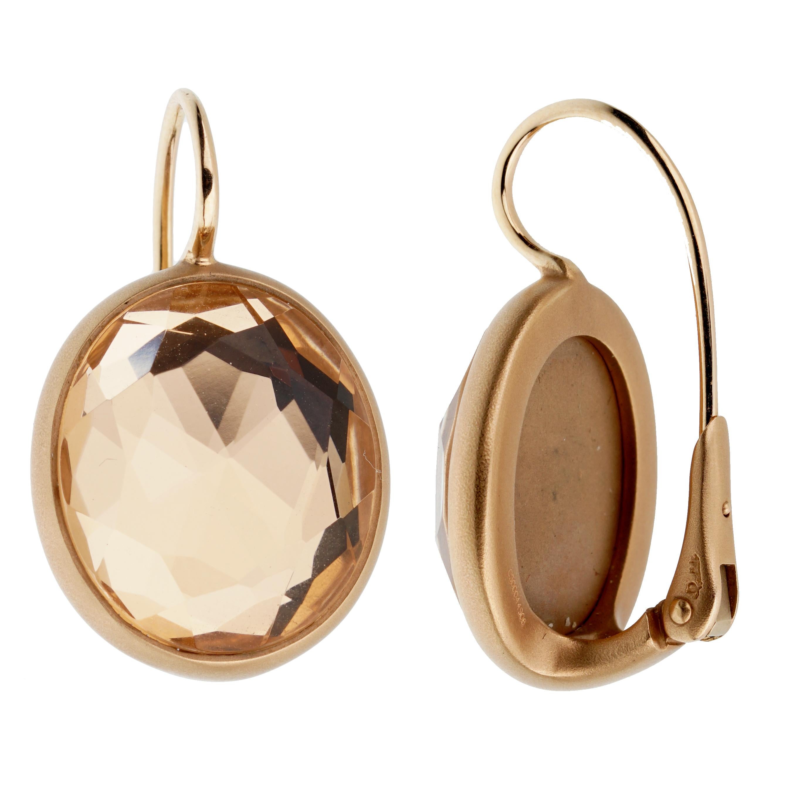 An amazingly chic pair of Pomellato earrings with faceted quartz wrapped in satin finished 18k rose gold. 