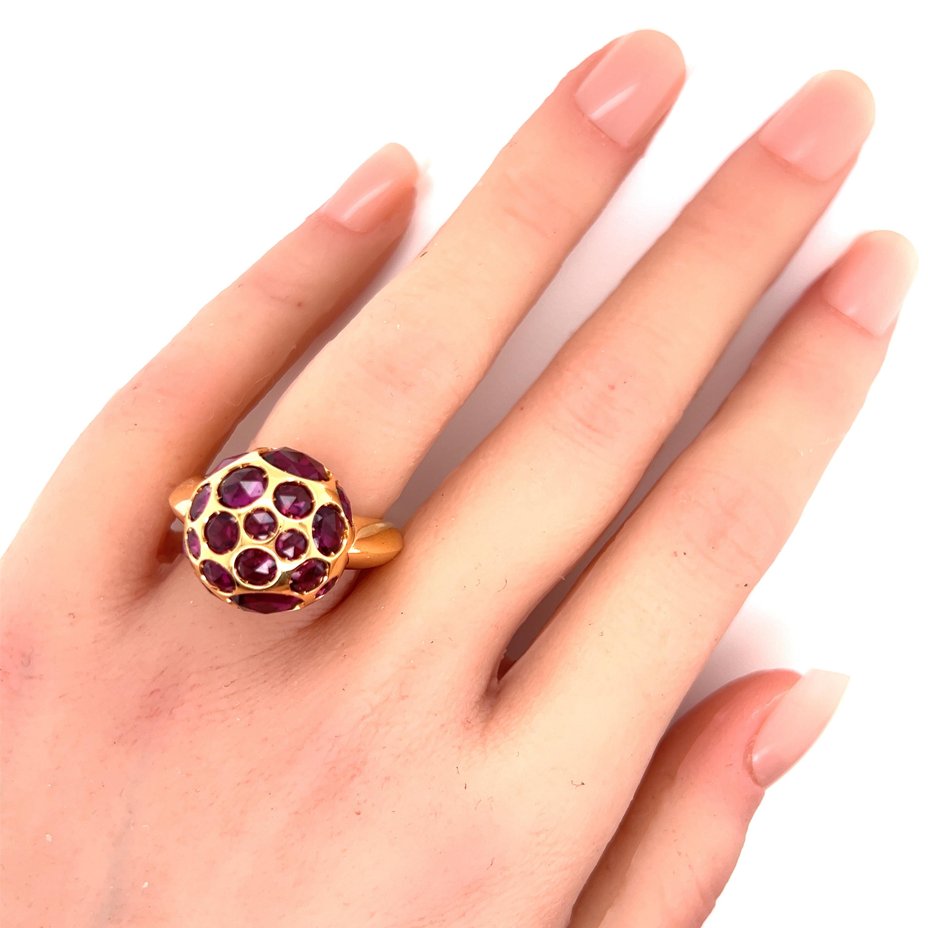 Brand:  Pomellato 
Hallmark: Pomellato 750 C700004438
Gemstone: rhodolite garnet 
Material: 18k rose gold 
Measurement:  top: 17mm round 
Ring size:  6.5
Weight: 19.6 grams

This is a gorgeous authentic ring by designer Pomellato from her Harem