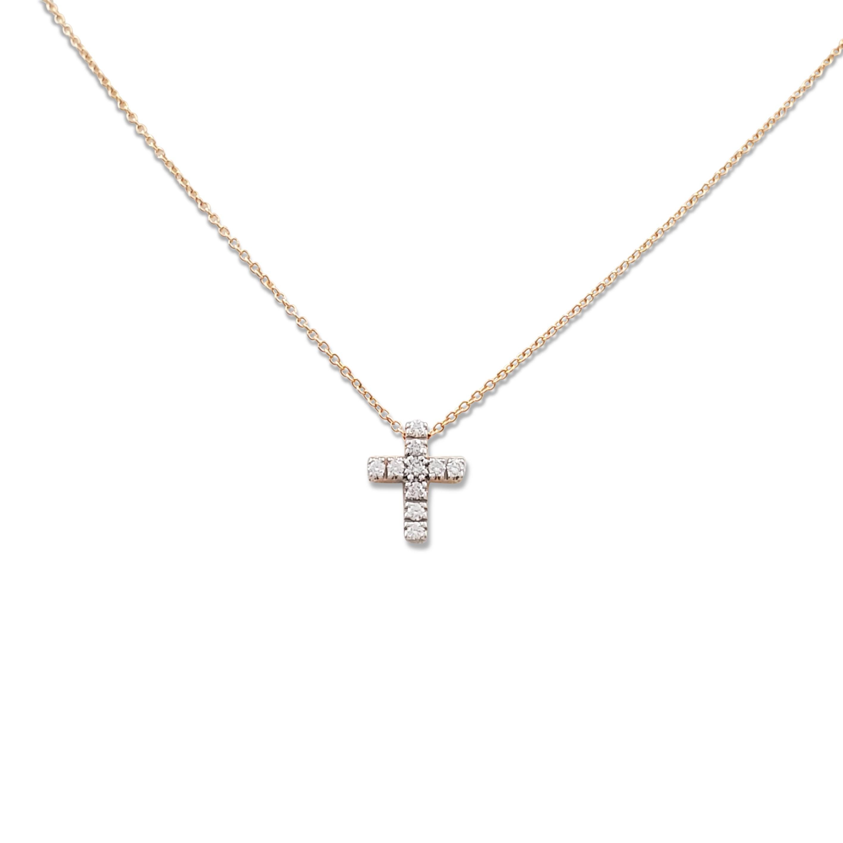Authentic Pomellato cross pendant necklace crafted in 18 karat rose gold and set with an estimated 0.15 carats of round brilliant cut diamonds (E-F color, VS clarity). Signed Pomellato, 750, with serial number. The necklace measures 15 1/2 inches in
