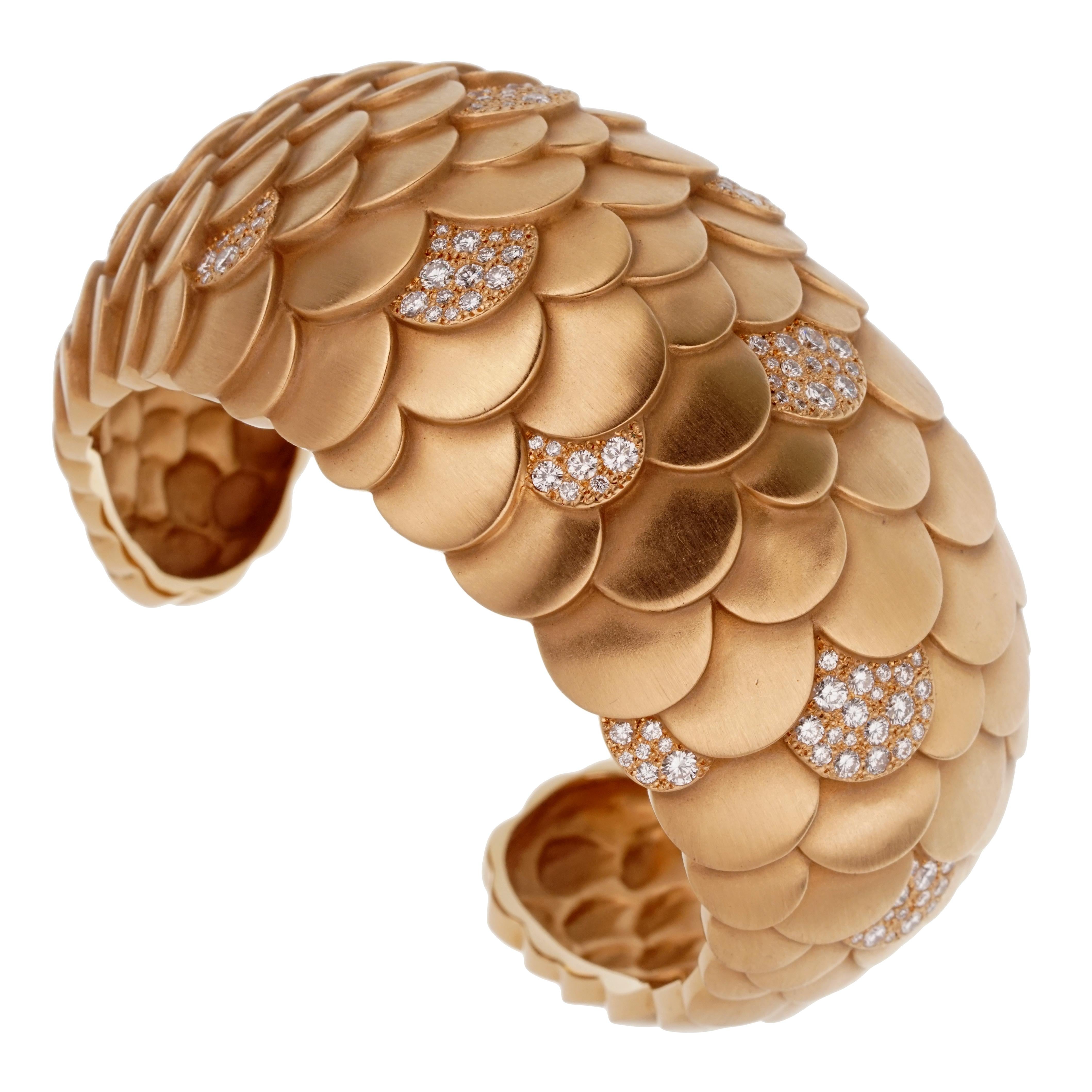 A magnificent Pomellato cuff bangle bracelet weighing an impressive 147 grams of 18k rose gold. The bracelet is adorned with 3.48ct of round brilliant cut diamonds, and will fit a 6 3/4