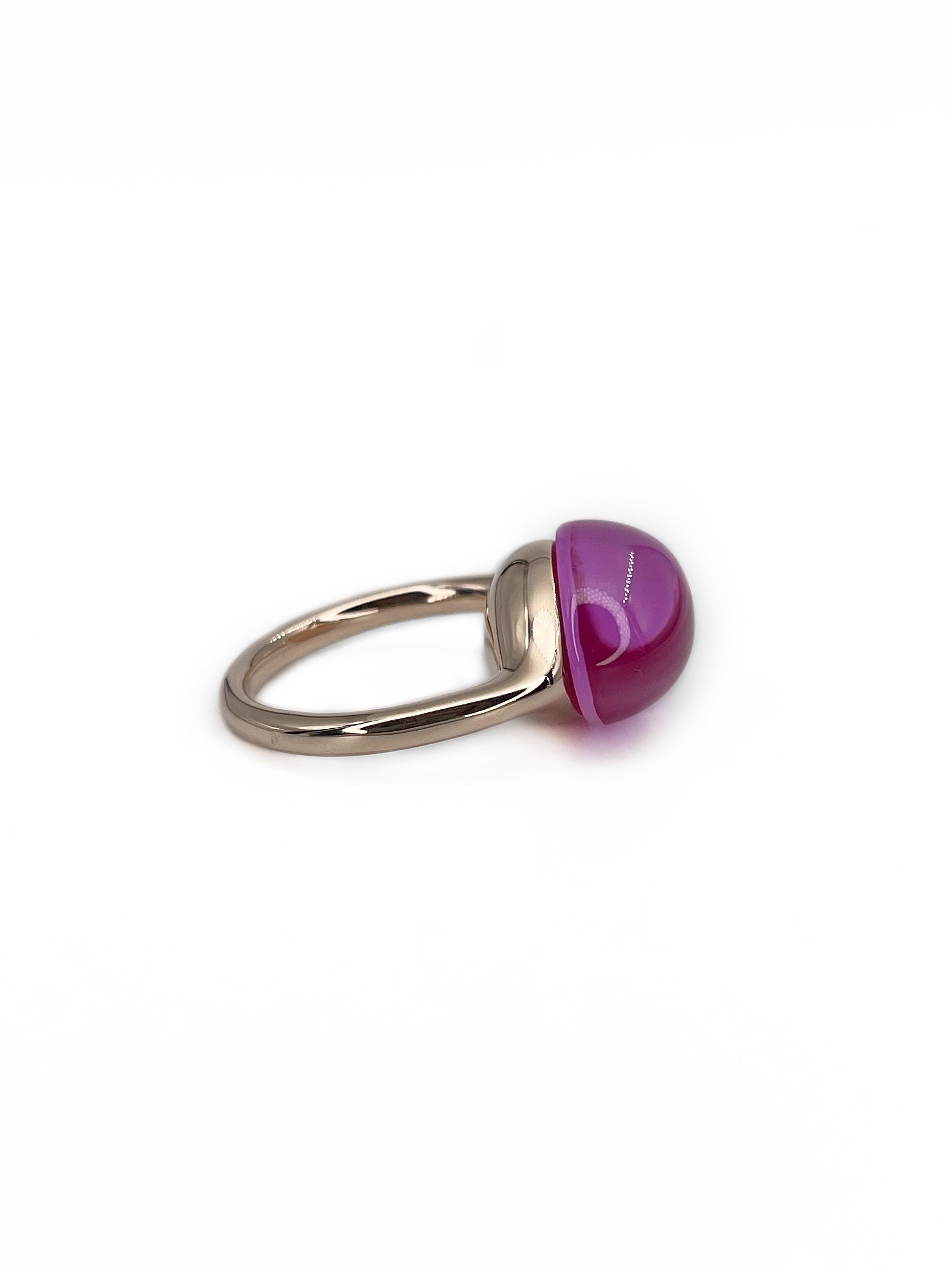 This is a Pomellato “Rouge Passion” iconic collection ring crafted in 9K gold. It is set with a fabulous synthetic pink cabochon cut sapphire.  

Signed: “Pomellato C130024369”

Weight: 7.12g
Size: 15.5 (US4.75)