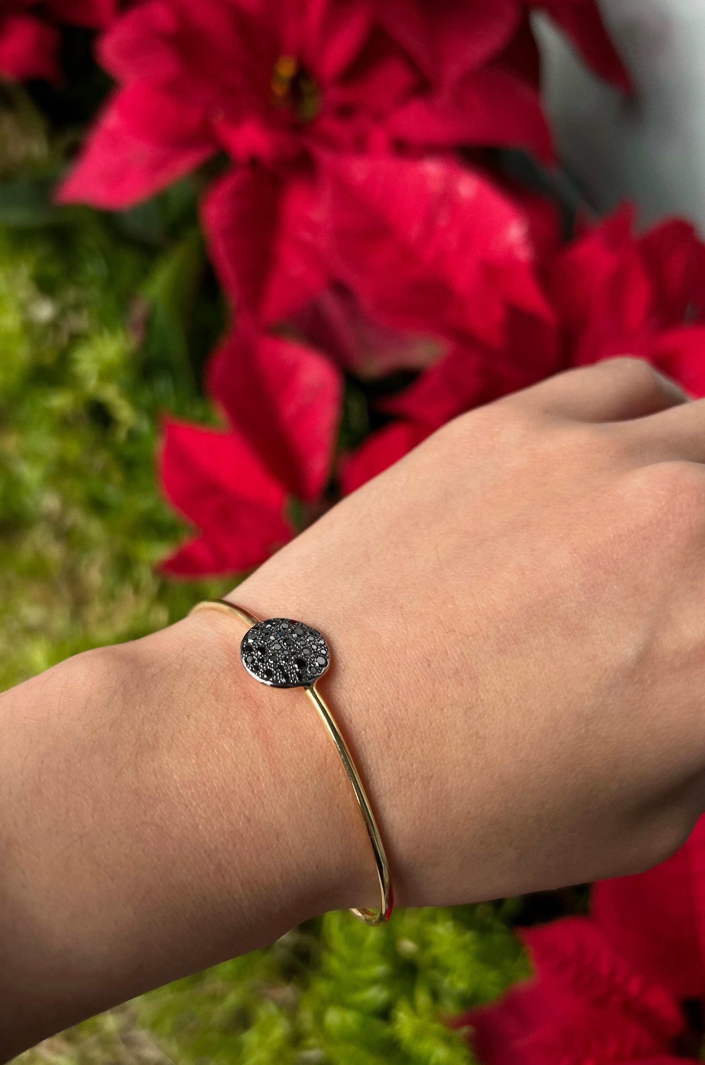 A pave of diamonds conjures images of sand sparking in the sun off the shores of the Mediterranean with this bangle bracelet from Pomellato. This slender bangle will embellish your wrist in all the right ways. Add to your collection today!

Style:
