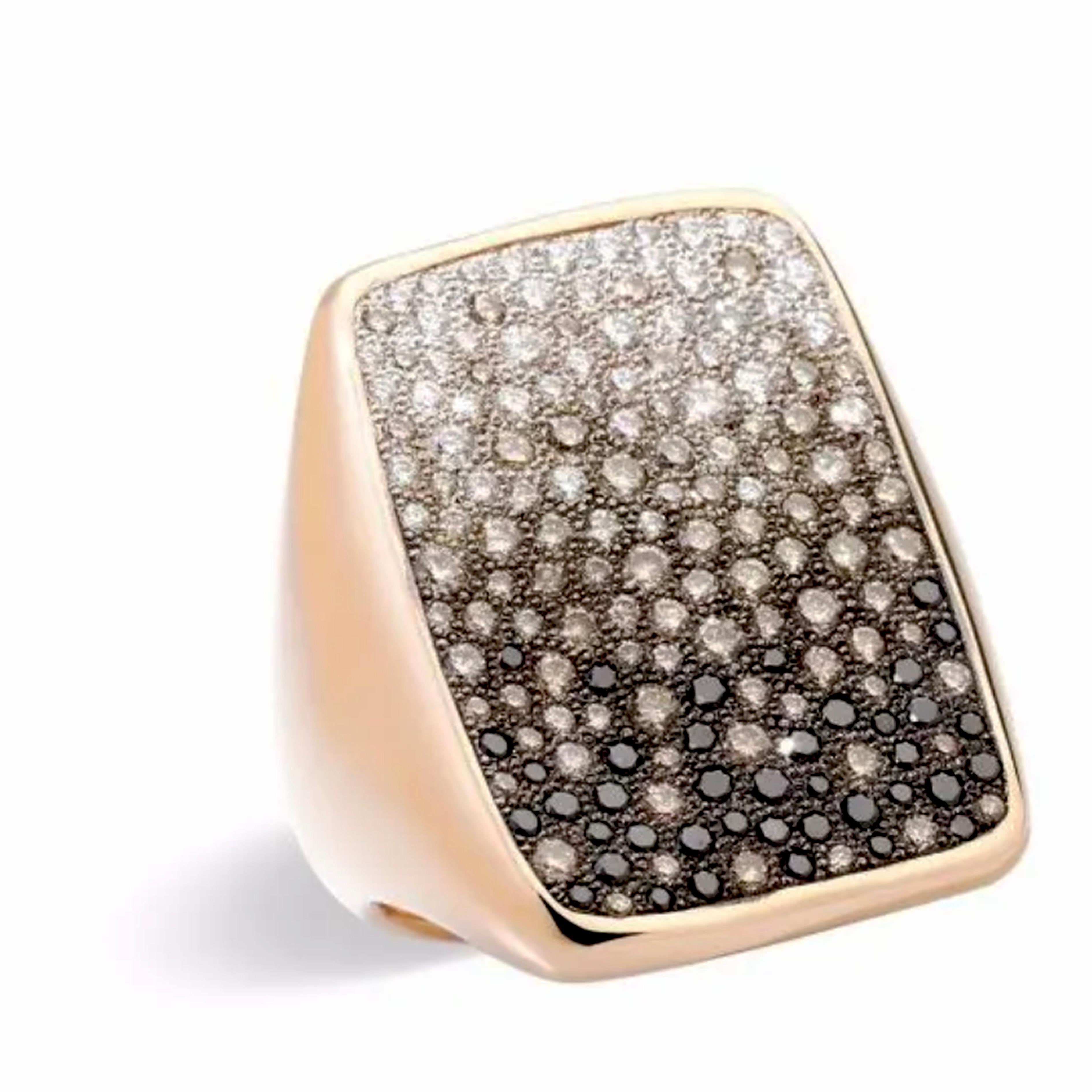 Part of Pomellato Sabbia, Sand Collection with white, black and brown diamonds that resemble small grains of sand on a metal surface, this awesome, great impact, large size ring is, like all Pomellato Jewels, a timeless contemporary classic.
For a