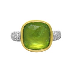 Pomellato Bague Shéhérazade en or blanc et jaune 18 carats Diamants et péridots