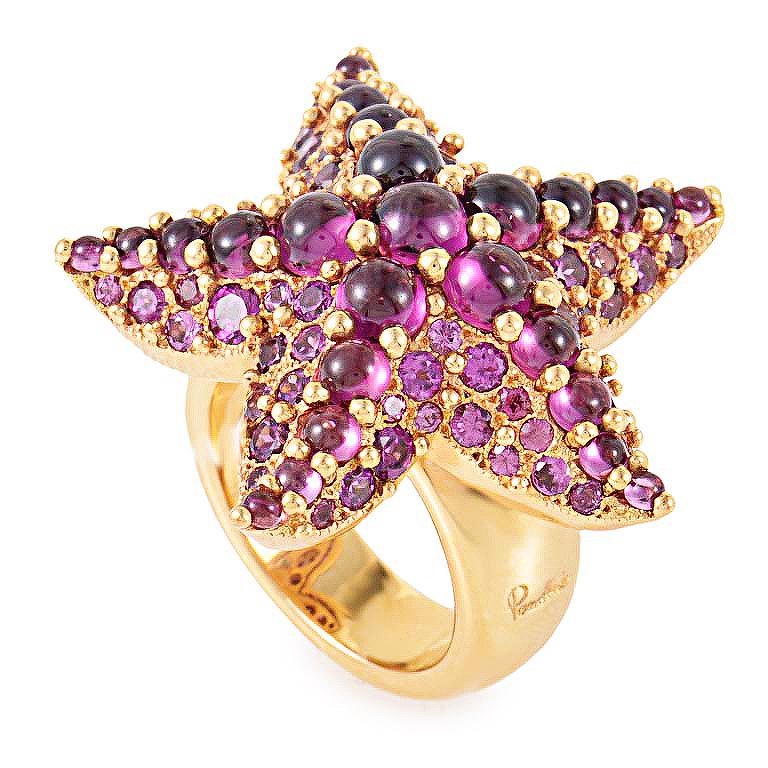 This Pomellato Sirene ring is glamorous and playful. It is made of 18K rose gold and shaped as a starfish. The starfish is then covered with gorgeous rhodolite gemstones
