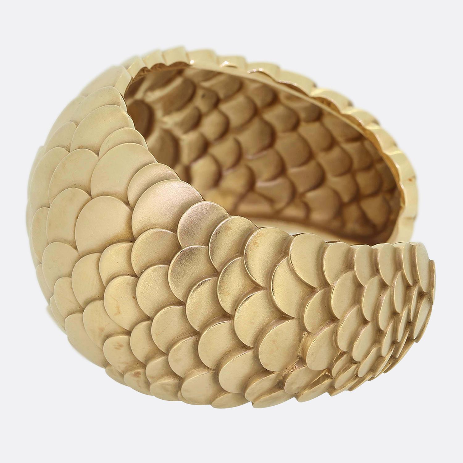 Here we have a wonderful cuff bangle signed by Maison Pomellato. This substantial piece forms part the Sirène collection and has been crafted from a pink 18ct rose gold to showcases a scaled design with a satin finish. 

Condition: Used (Very