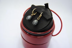 Pomellato Tabou Earrings in 18 Karat Burnished Gold and Blue Topazes