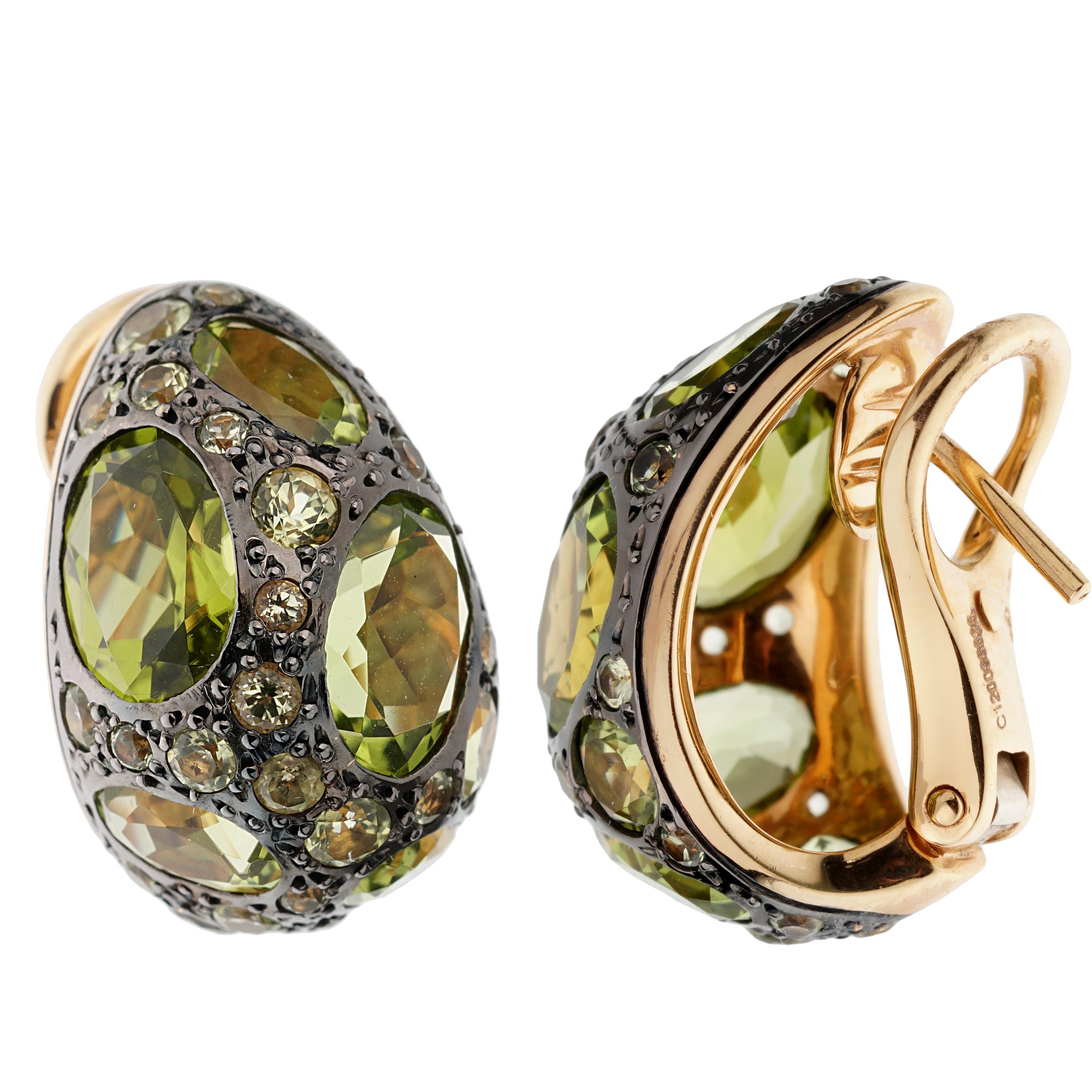 A fabulous set of Pomellato earrings from the Tabou collection showcasing burnished rose gold and embellished with intensely-coloured peridot stones with a faceted surface. The earrings measure .65