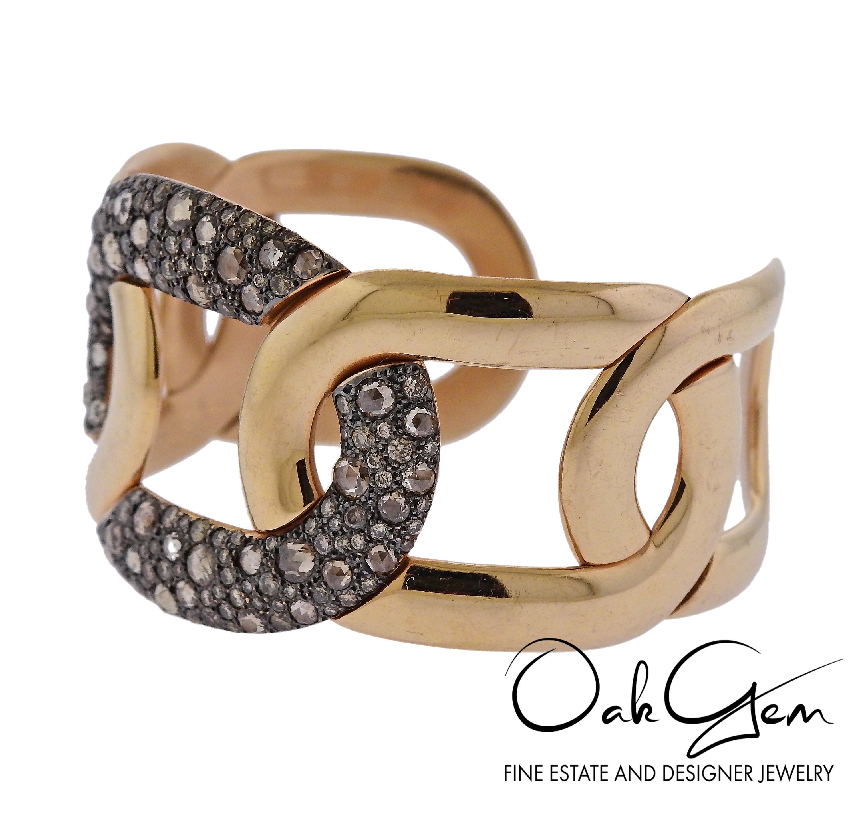 Impressive 18k gold cuff bracelet, crafted by Pomellato for Tango collection, adorned with a combination of rose cut fancy brown and white round brilliant diamonds (total of 5.17ctw). Retail approx. $31,305 ( € 27.500).  Bracelet will fit up to 7