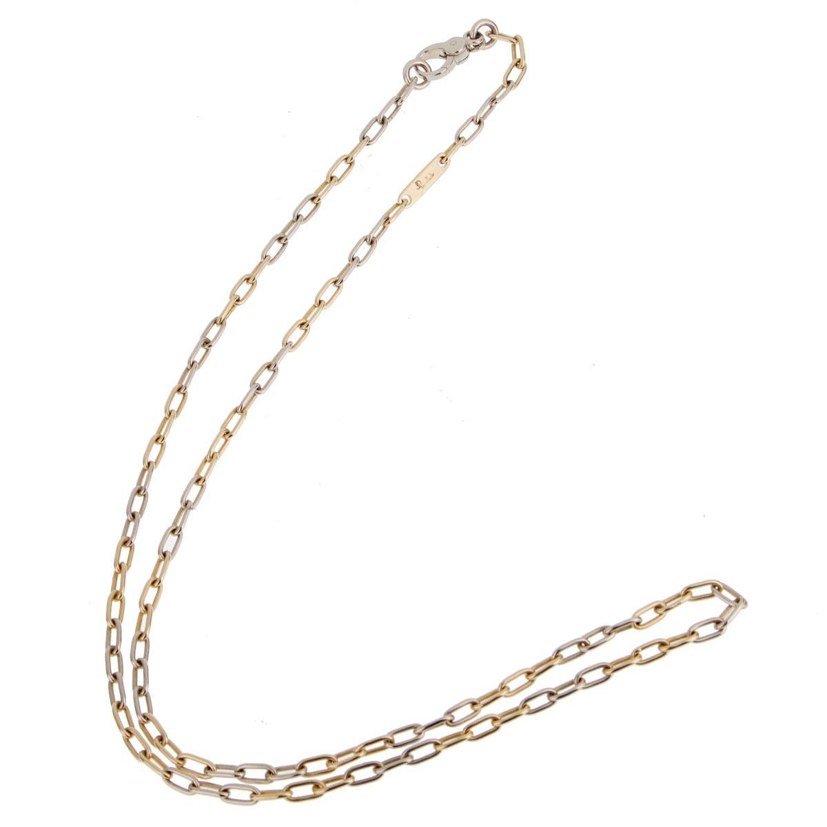 A chic Pomellato chain link necklace showcasing alternating 18k yellow and white gold links measuring 23