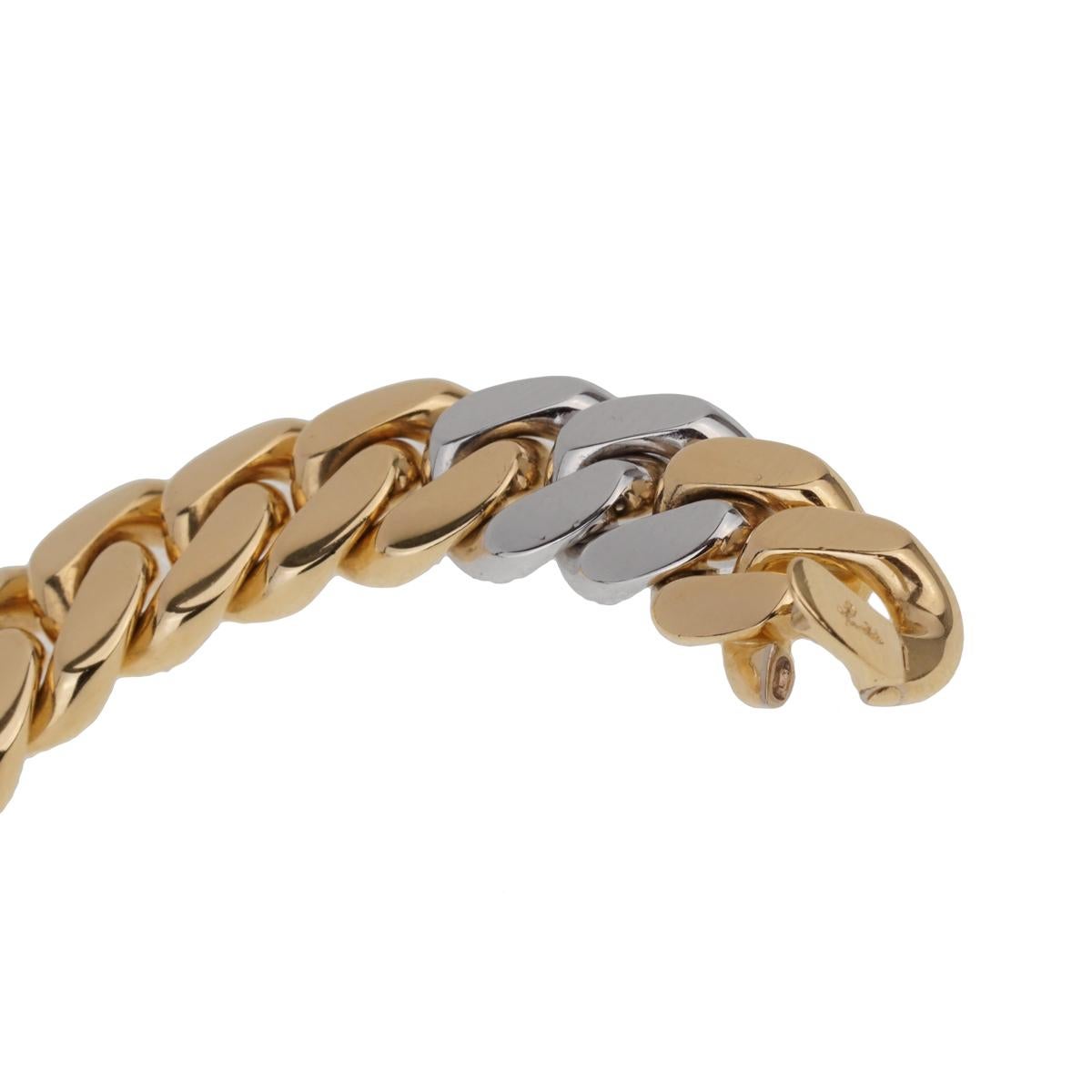 A must have piece by Pomellato featuring a two tone Cuban link bracelet in 18k white and yellow gold. The bracelet has a length of 7