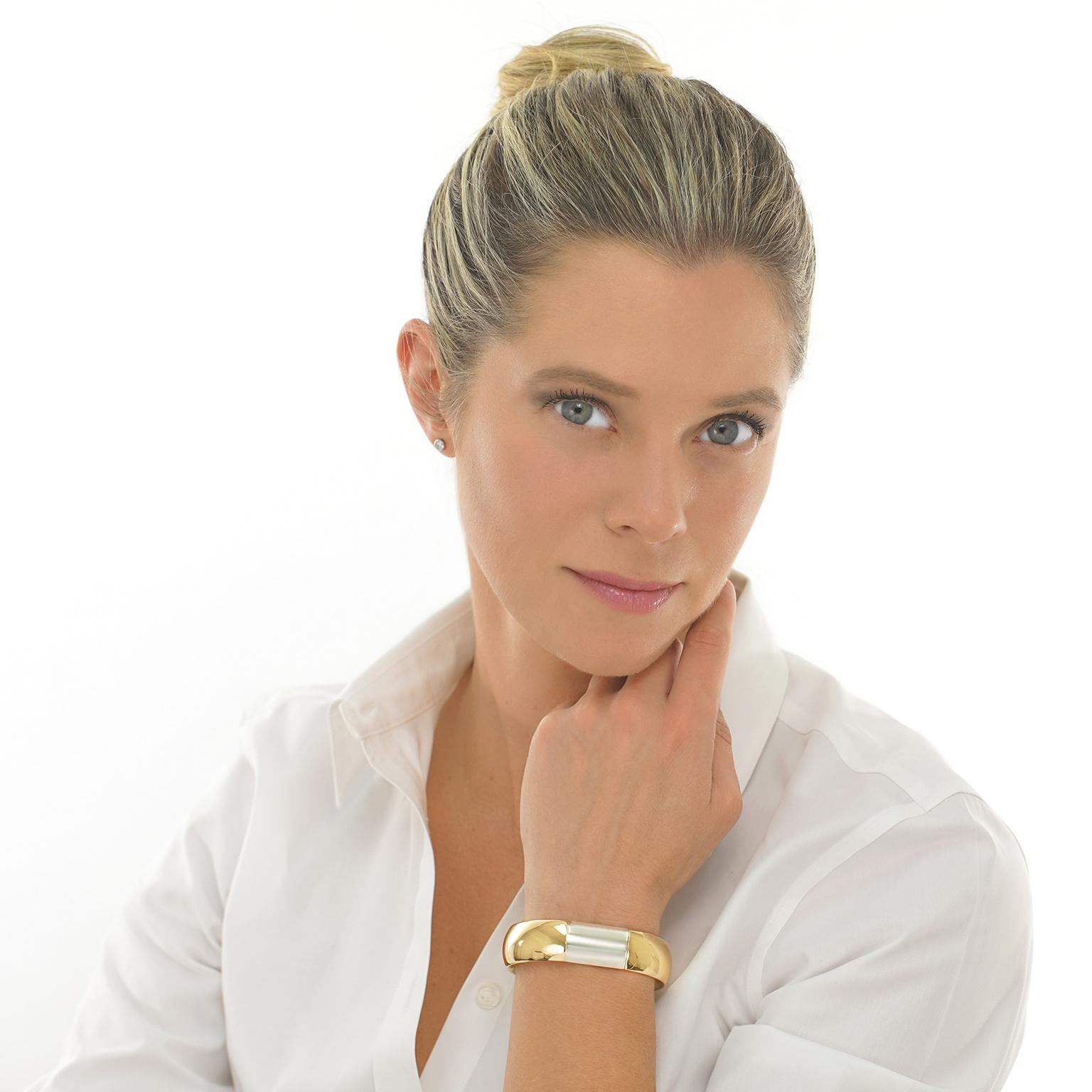 Circa 2000, 18k, by Pomellato, Italy. This ultra-chic Pomellato bracelet epitomizes effortless Italian style. Yellow gold curved elements are punctuated with sleek white gold panels creating visual tension underscored by physical balance. Expertly