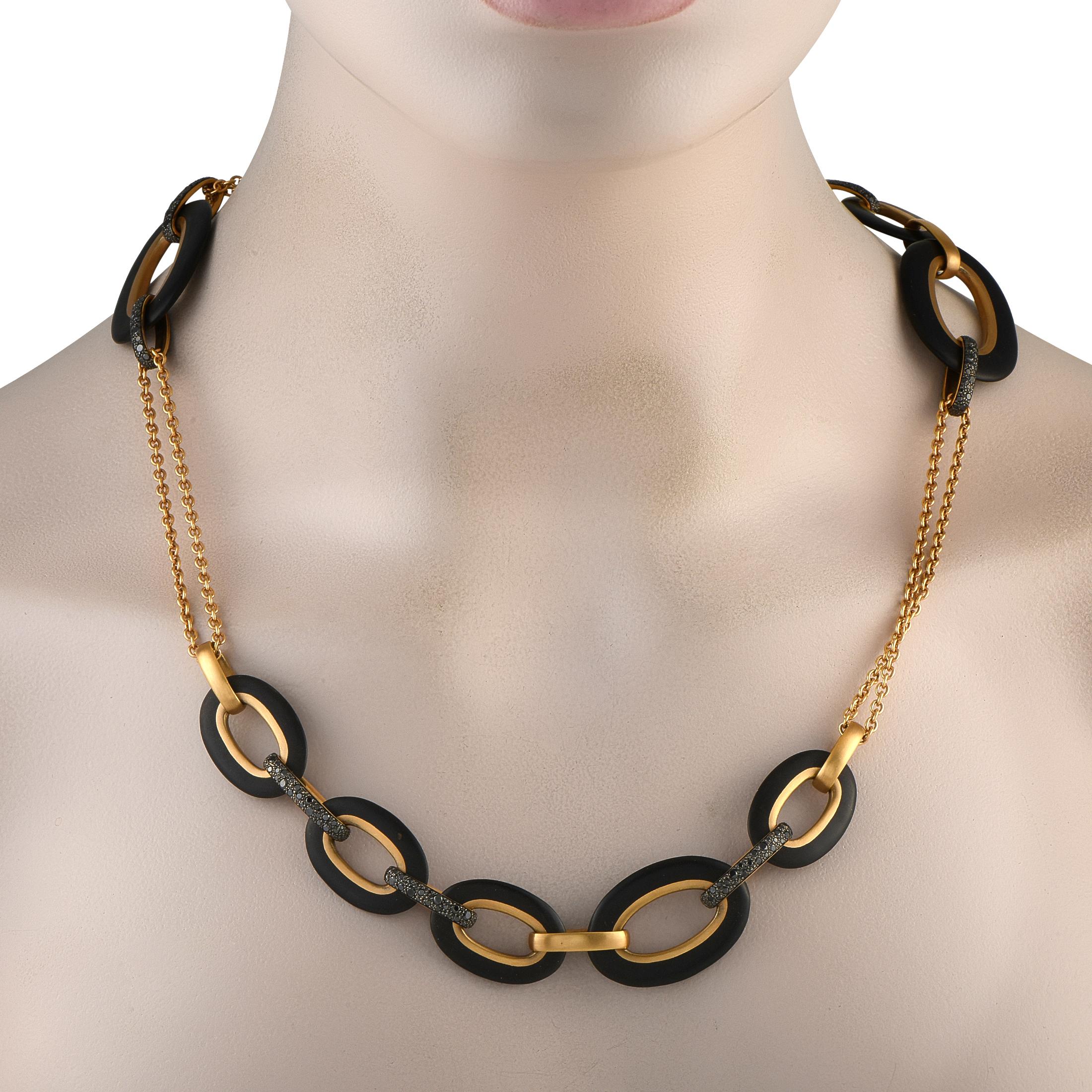 Take any ensemble to the next level by adding this bold Pomellato Victoria necklace. Oversized Black Jet links contrast beautifully against the 18K Yellow Gold chain. Diamonds with a total weight of 4.70 carats add extra texture and dimension to