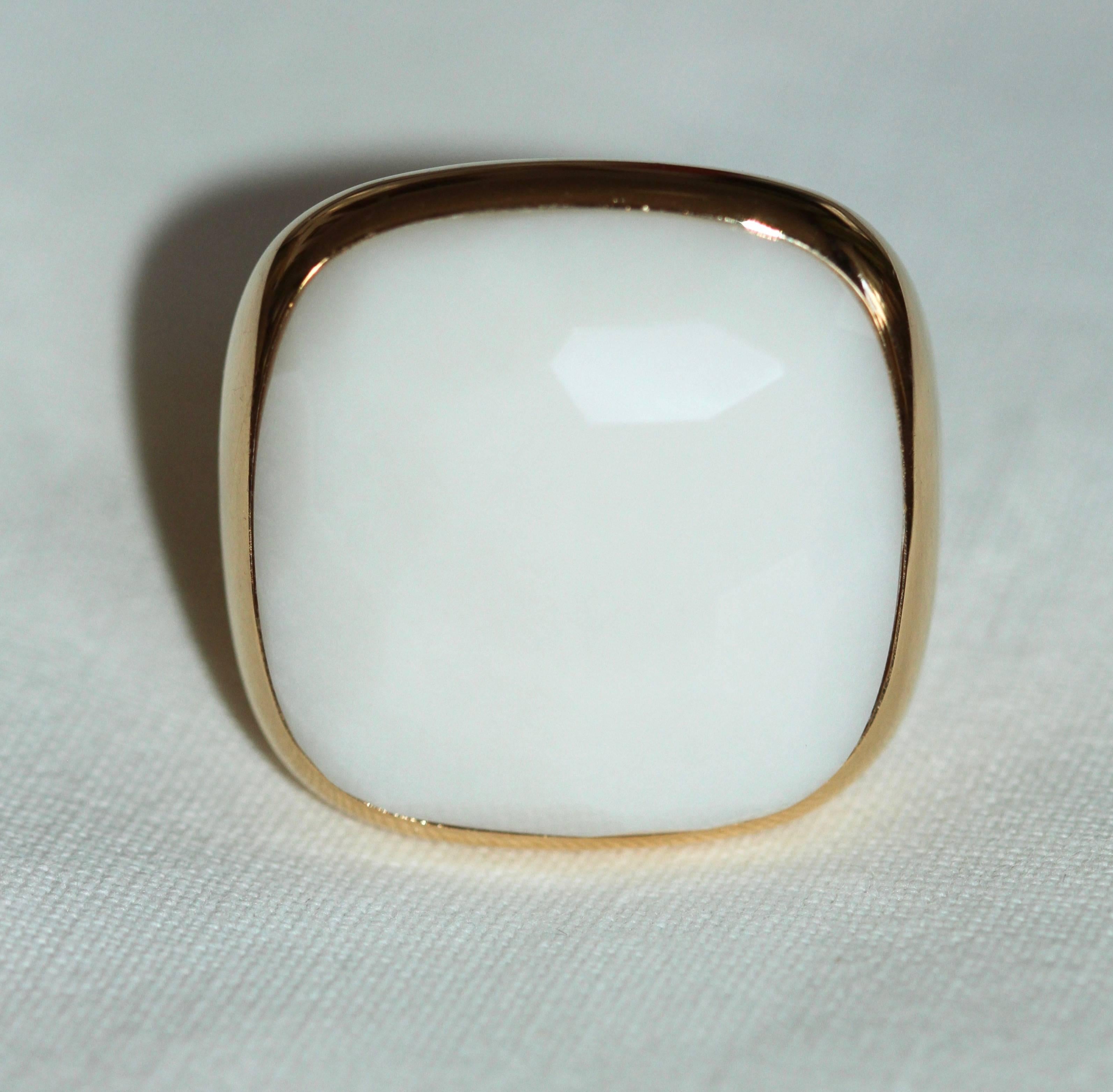 Elegant pre-owned ring from Pomellato. 
The rounded design of this ring is enhanced by a sophisticated white stone in cacholong with a faceted surface. 
Size : 53
Condition: Excellent 
Comes with : Box

All items are subject to a strict quality