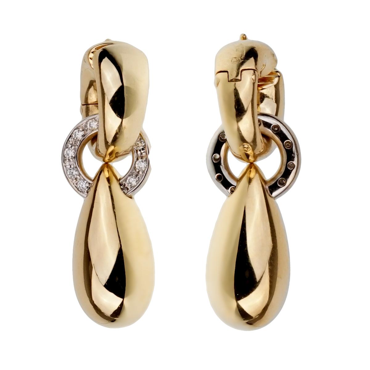 A fabulous pair of vintage Pomellato drop earrings set in 18k yellow gold with 18k white gold diamond accented circles.

Length: 1.40