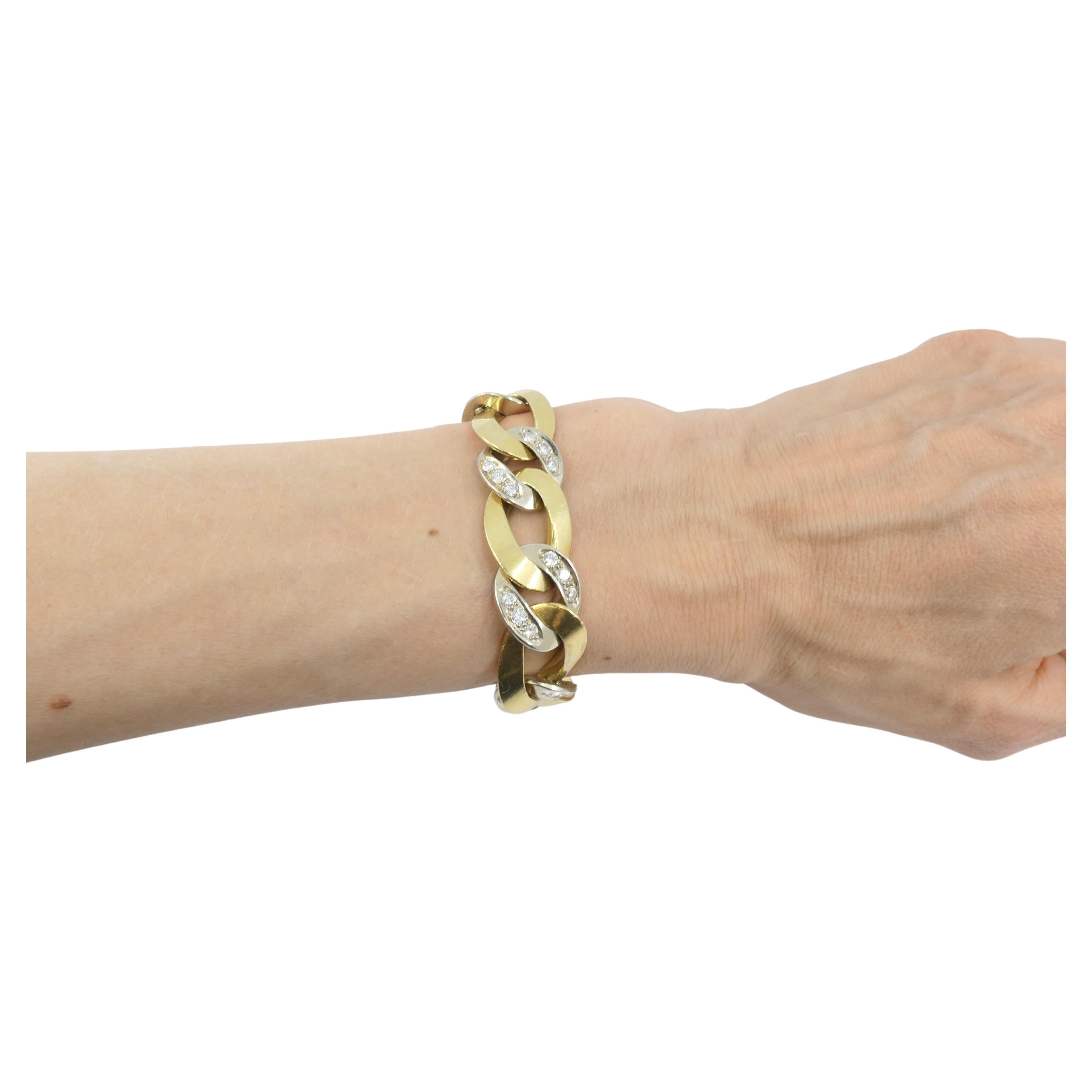 A beautiful link bracelet with a bling by Pomellato. Made of 18k gold, the bracelet comprises elongated yellow gold links alternating with round white gold links. The latter are embellished with diamonds that are set in groups of three in the little