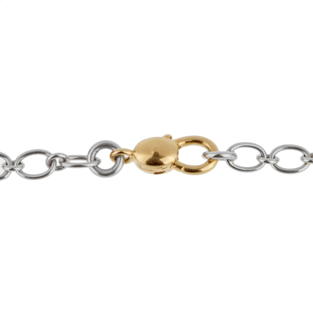 A fabulous chain link necklace by Pomellato showcasing intertwined 18k white gold links followed by the iconic 18k yellow gold clasp. The necklace measures 17