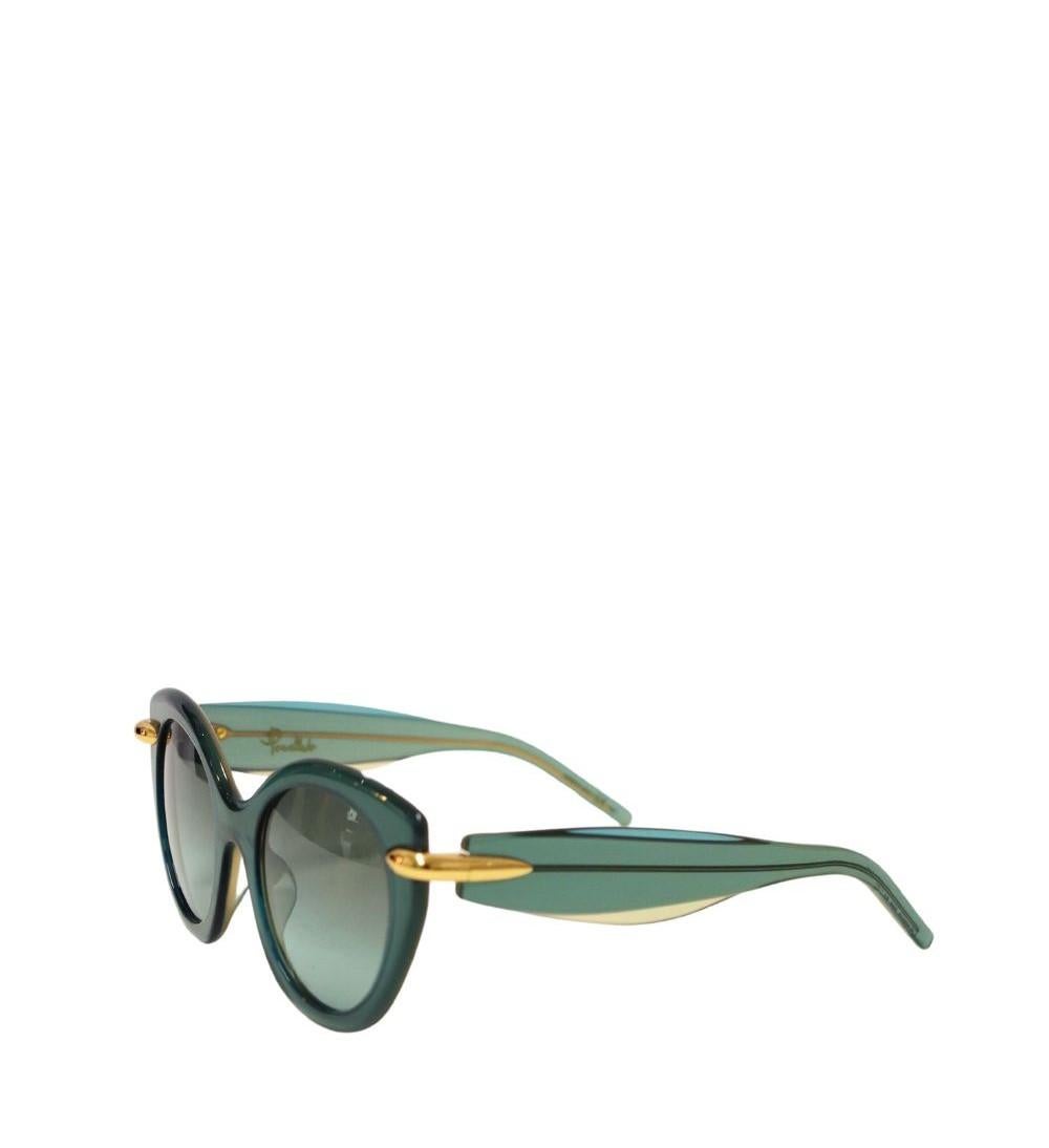 Pomellato Women's Green Cat-Eye Sunglasses, Featuring a tinted gradient lenses, gold accents, 100% UV Protection and thick arms with angled tips.

Hardware: Acetate 
Lens: Green
Lens Width: 50mm
Lens Bridge: 22mm
Arm Length: 140mm
Overall Condition: