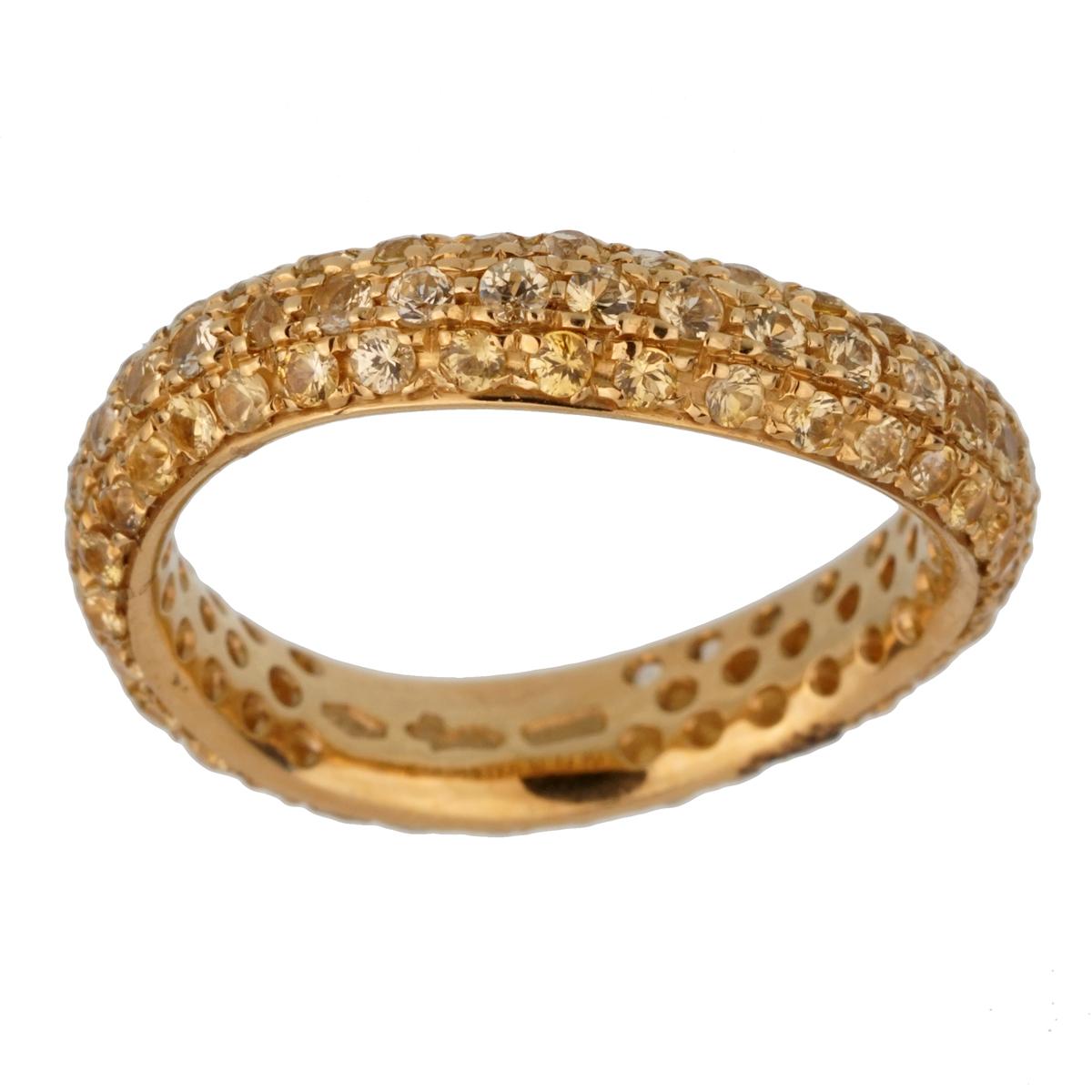 A fabulous brand new Pomellato yellow gold wave style band ring adorned with 2 rows of yellow sapphires. The ring measures a size 6 3/4

Sku: 2455