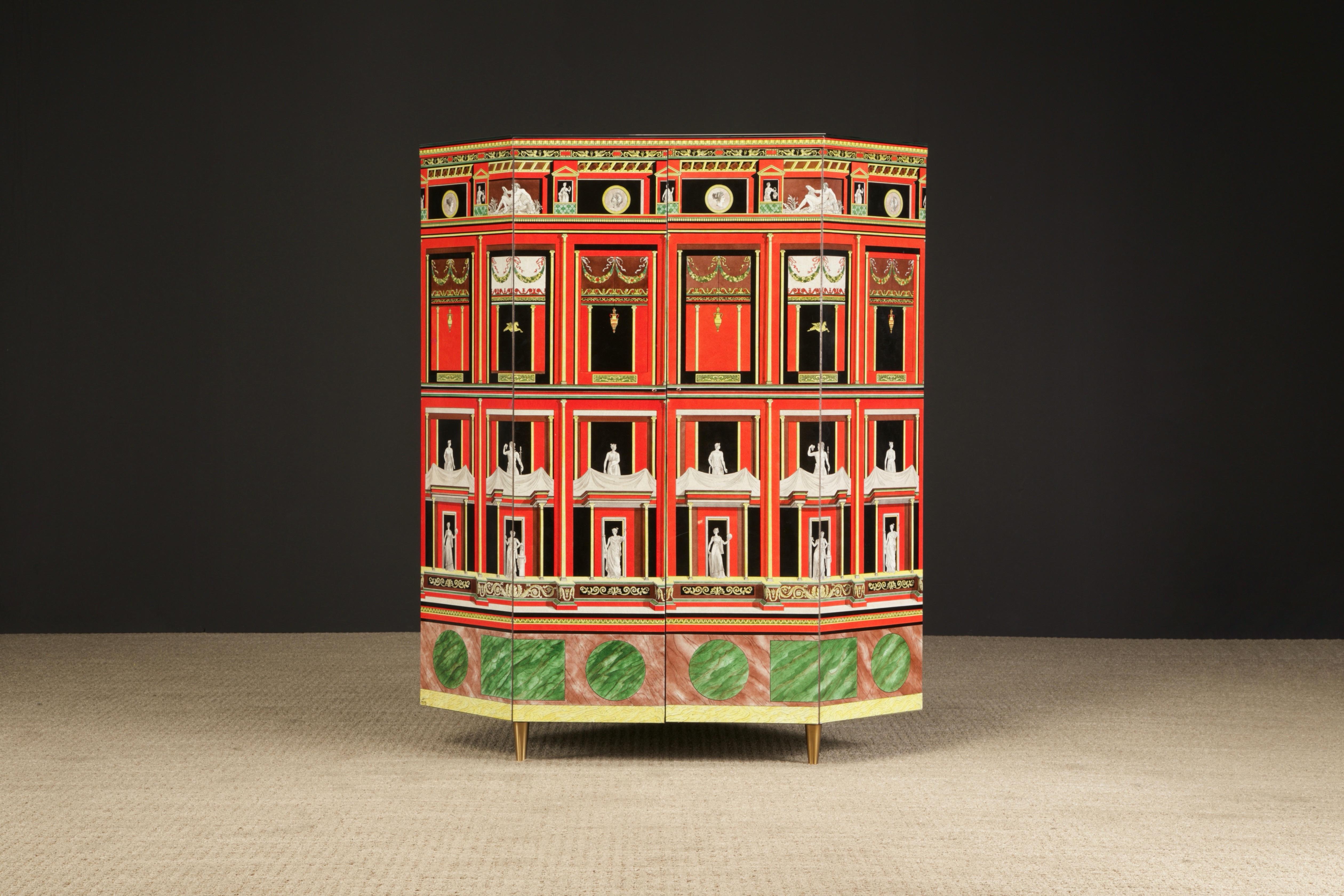 This 'much larger than it looks' collectors item is the 'Pompeiana' corner cabinet by Piero Fornasetti, completed in 1988, signed, dated and numbered 2 of 2.  Fornasetti cabinets, especially corner cabinets, are extremely rare as production was