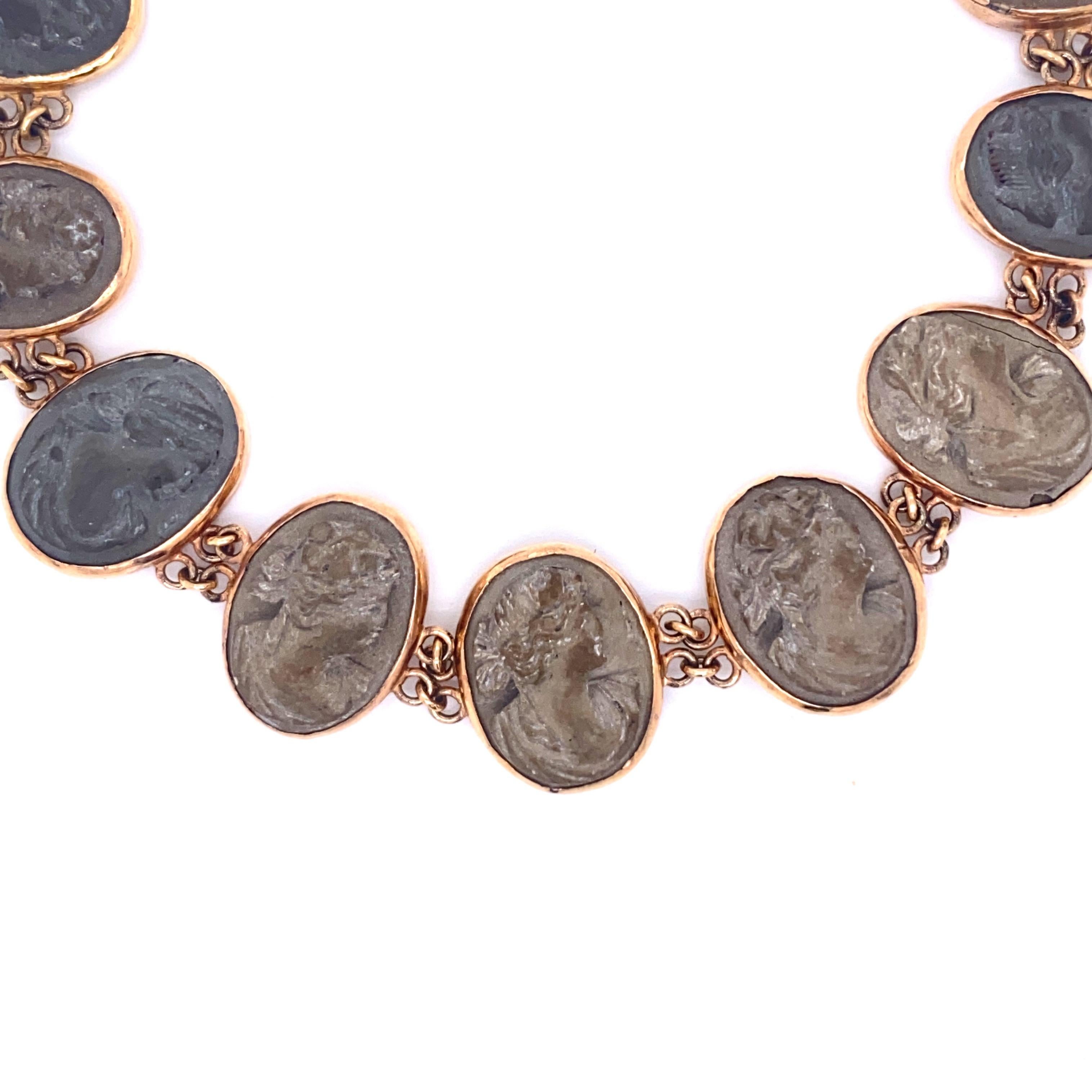 This wonderful lava bracelet was sold in Naples in the 1950's. Made by Pompeian stone cutters, each of the nine round heads of the bracelet is distinctly carved and is of a different hue and comes from a different organic material sourced from