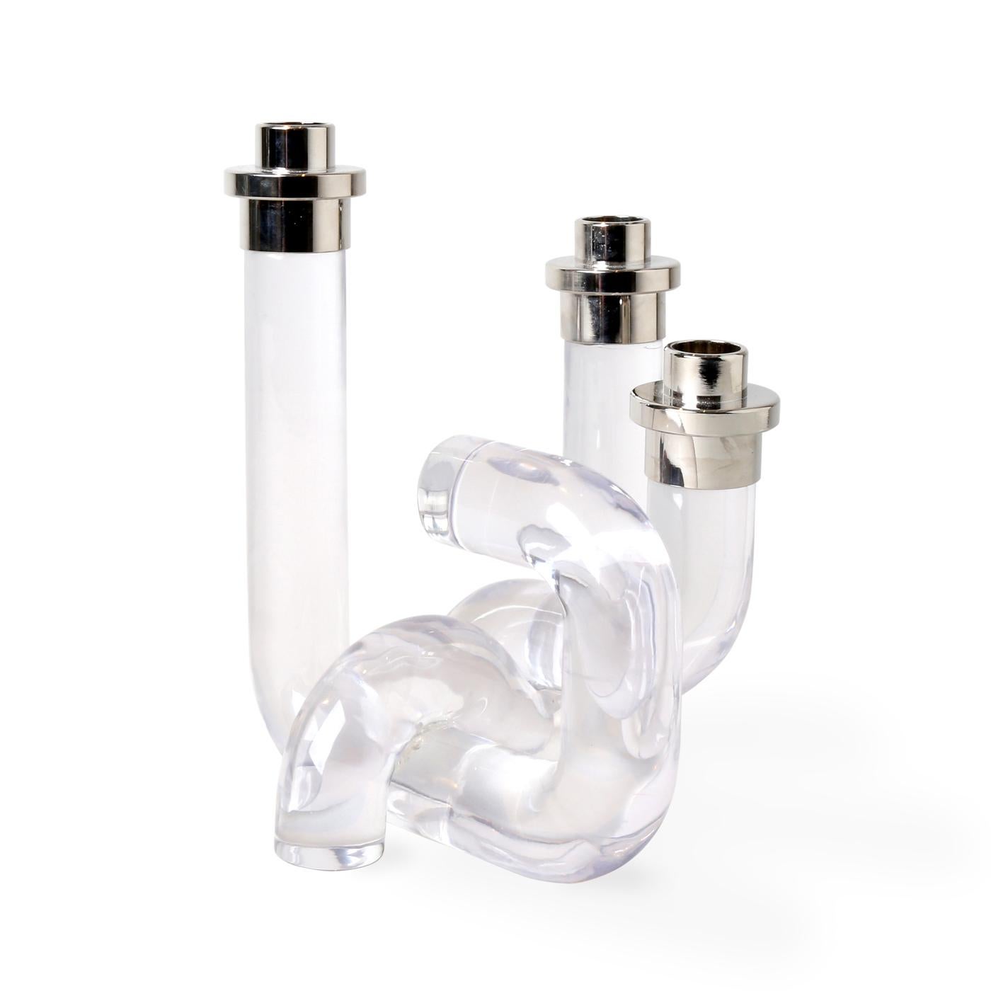 Pipe Up. Our Pompidou Candleholders pair 70s-inspired patterns with daring dimension for added ooomph. Featuring solid acrylic pipes fused together and accented with polished nickel. Chic clear lucite creates a modern glow to match any mood. Also