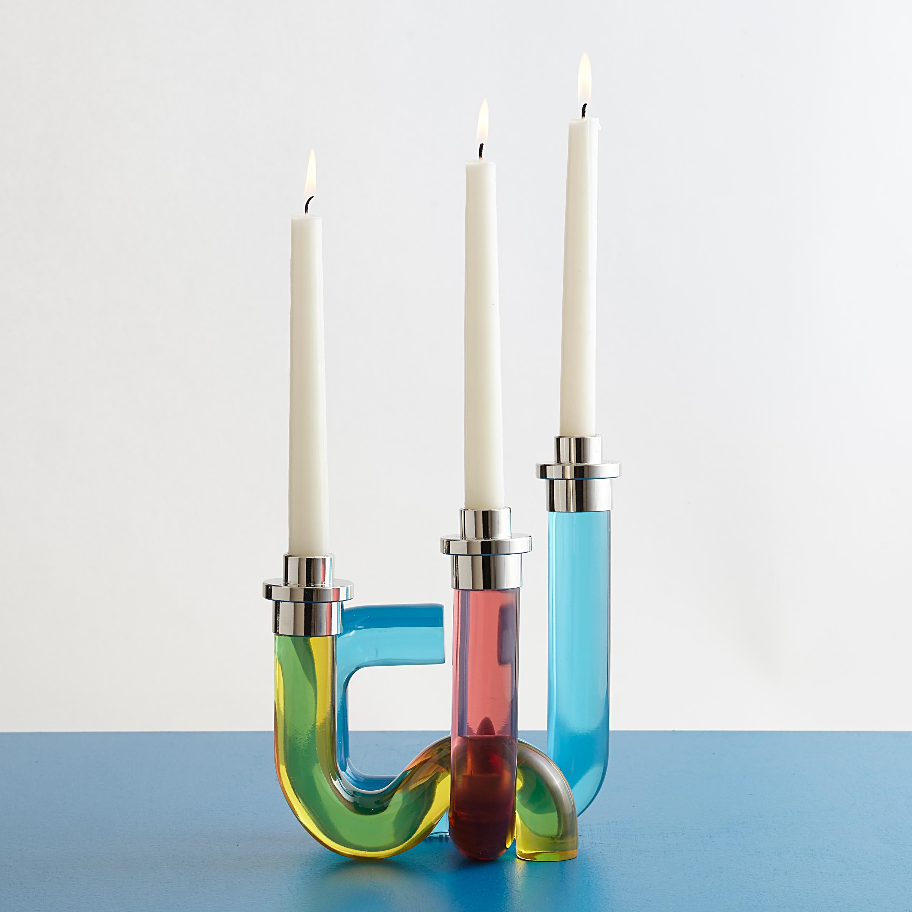 Pipe Up. Our Pompidou Candleholders pair 70s-inspired patterns with daring dimension for added ooomph. Featuring solid acrylic pipes fused together and accented with polished nickel. A bold primary colorway creates a modern glow to match any mood.