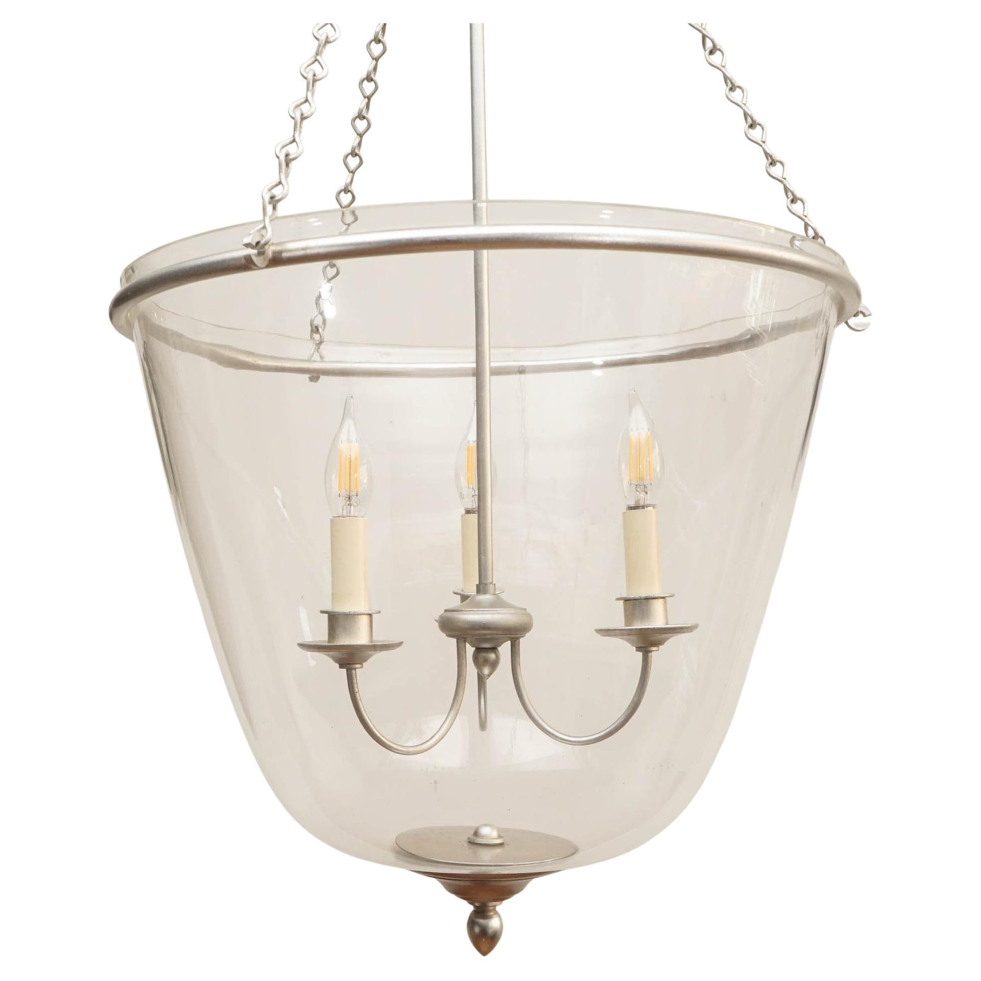The elegant Pondview by AERIN updates one timeless design by pairing it with another. A simple candelabra floats visibly within a glass bell shade, gracefully illuminating any entryway or foyer.