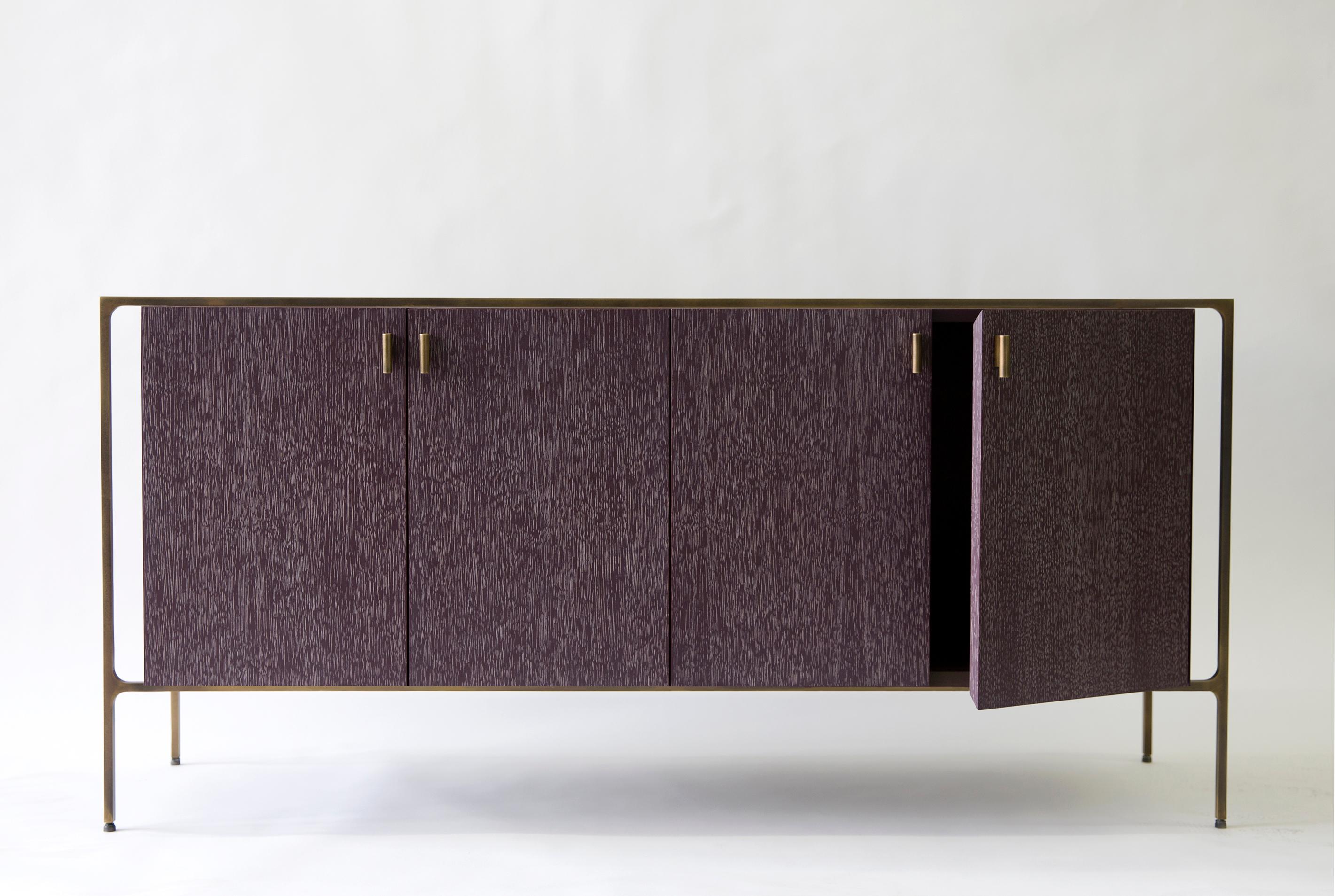 With the signature Lumifer brass 'T' component, the Ponte Credenza juxtaposes a delicate brass frame with a wooden monolith.
Each of the two parts maintains its own language, materiality, and texture, making no effort to appear as a uniform body.
