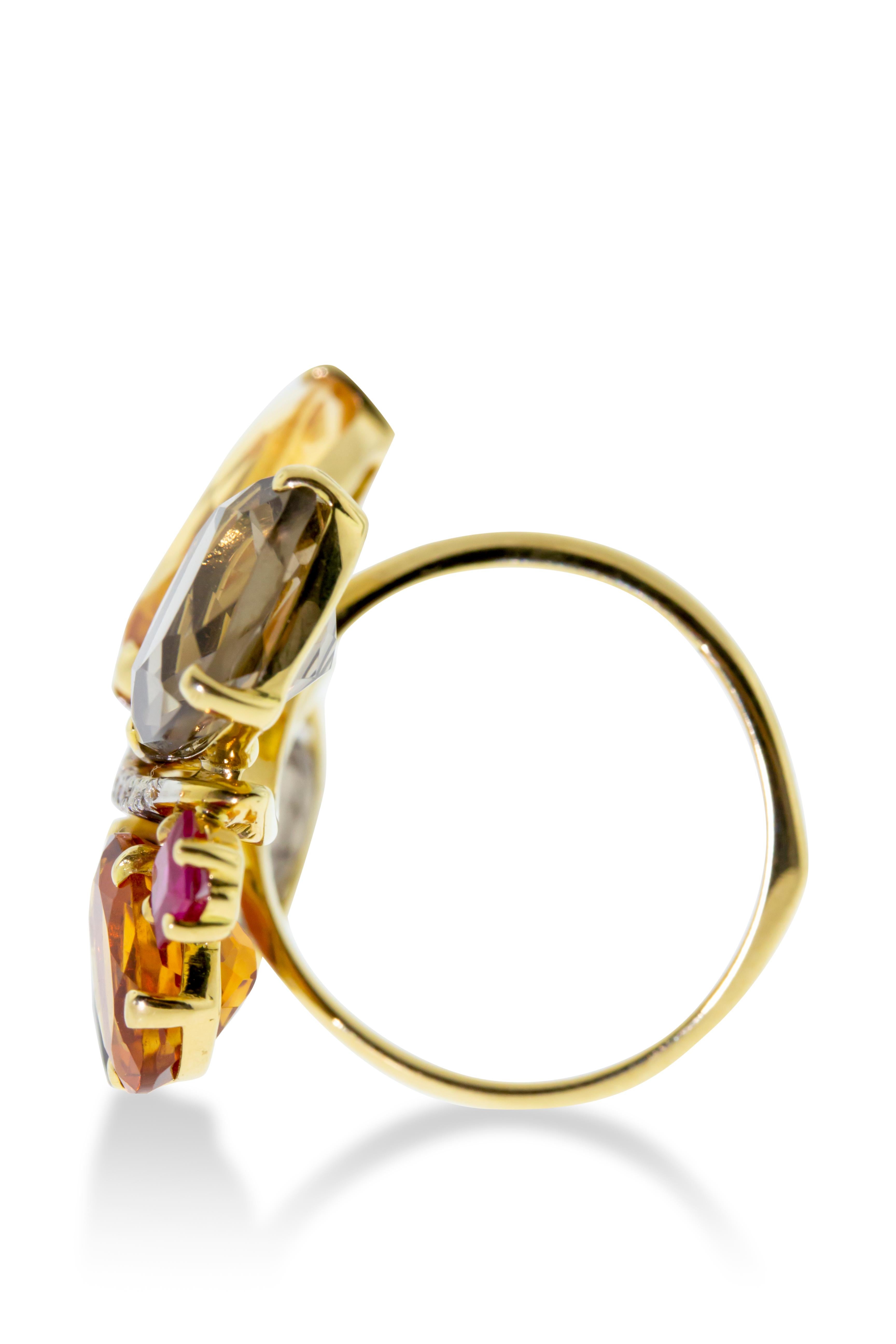 18K yellow gold Ponte Vecchio Gioielli cocktail ring featuring 16.7 carats quartz, 0.41 carats of rubies, and a 0.05 carat round cut diamond. 8 grams of high polish 18K yellow gold. Made in Italy. Size 6.5.

Viewings available in our NYC showroom by