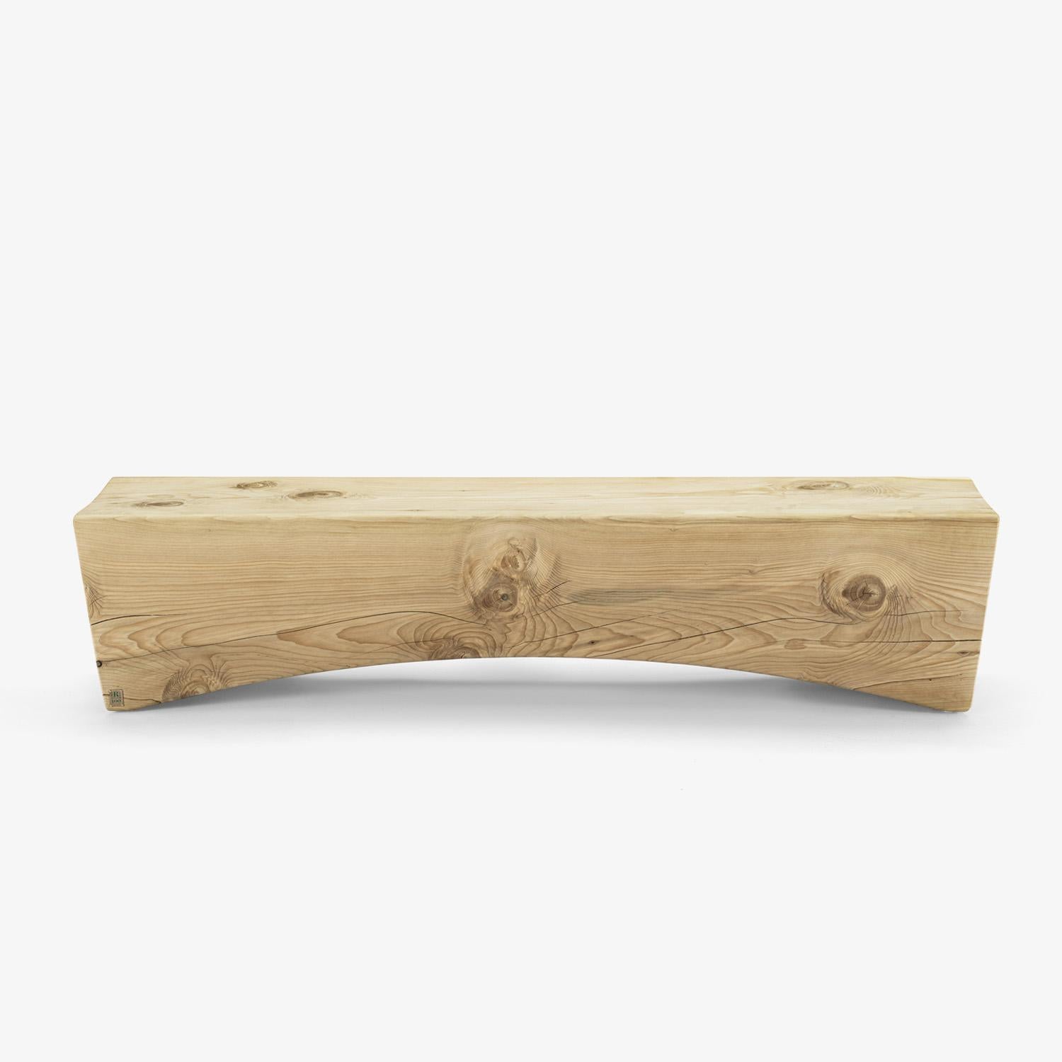Solid scented cedar wood bench carved from a single block, characterised by a square, linear shape that meets a curved shape below the seating surface, lightening the visual effect.

Available in the below dimensions:
W.140 x D.42,5 x H.43,8cm
W.190