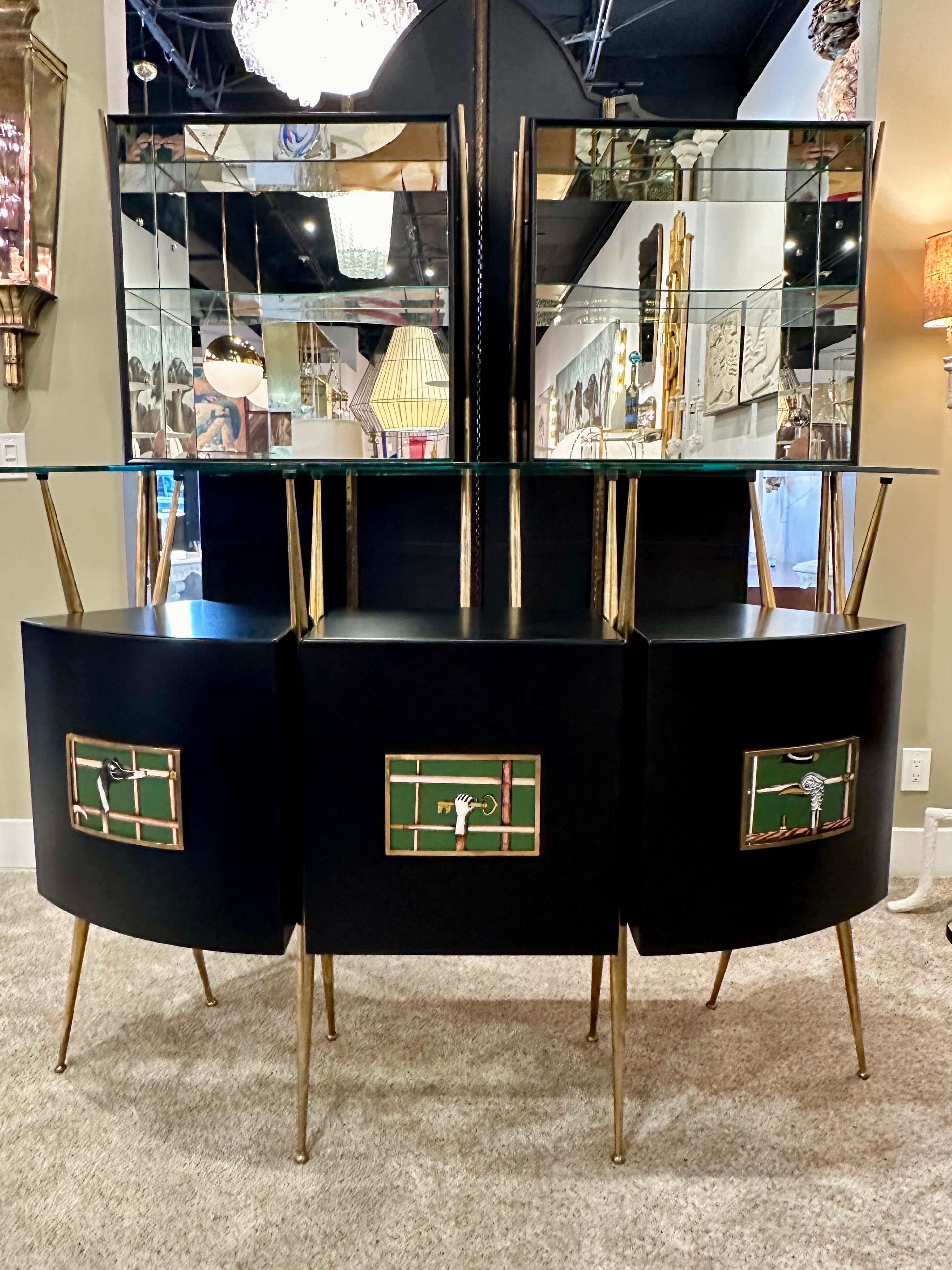 This wonderfully restored and updated Bar Set in the style of Gio Ponti. Restored n solid matte black and brass hardware, legs and pulls, this set includes the main dry bar with open shelving for bottles and drawers. Included: curved dry bar with