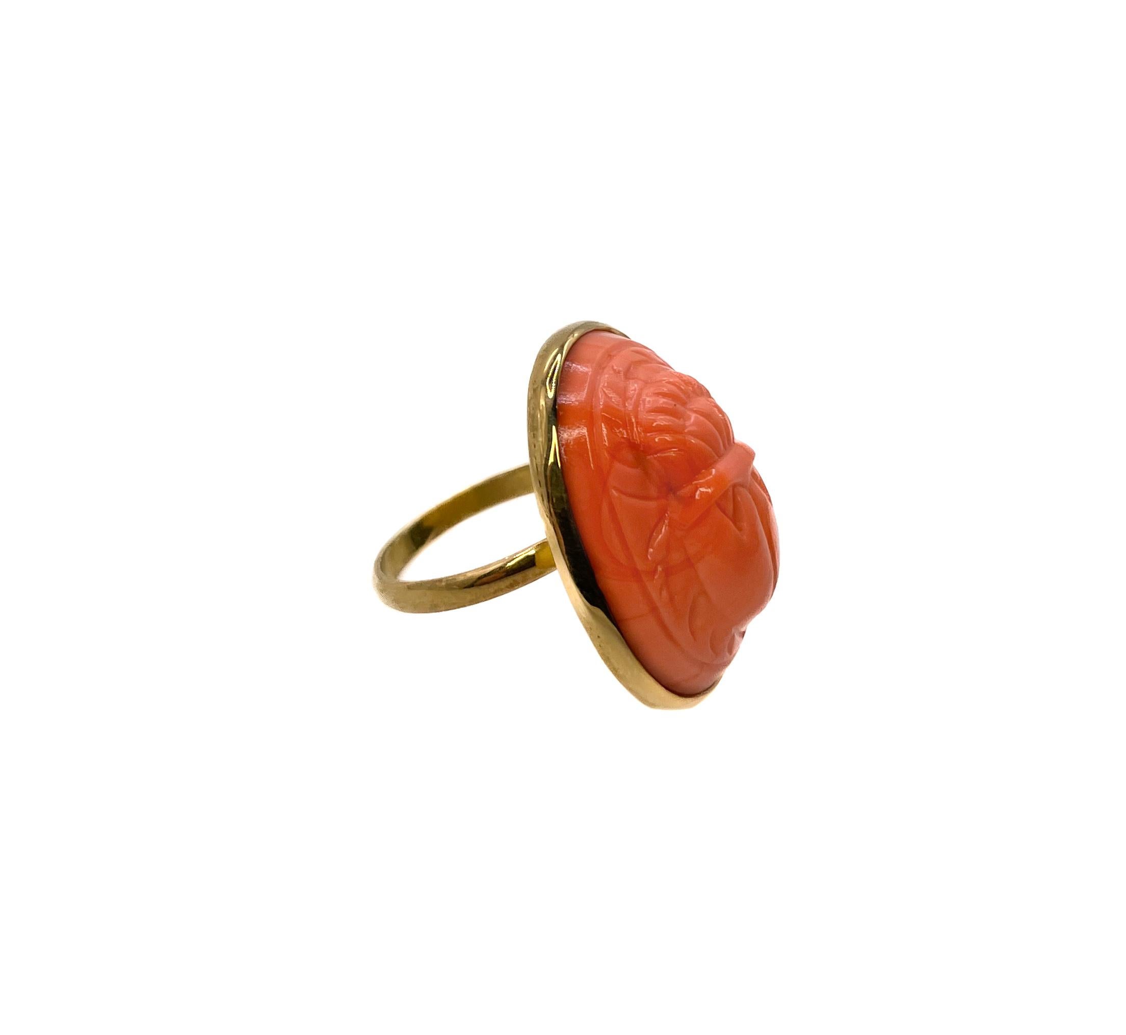 This Scarab ring is made from orange molded glass. The glass was made in the 1950s in Japan. 

The Egyptian Revival style became popularized in Japan in response to the discovery of King Tut's Tomb in 1922. Scarabs were sacred in ancient Egypt and